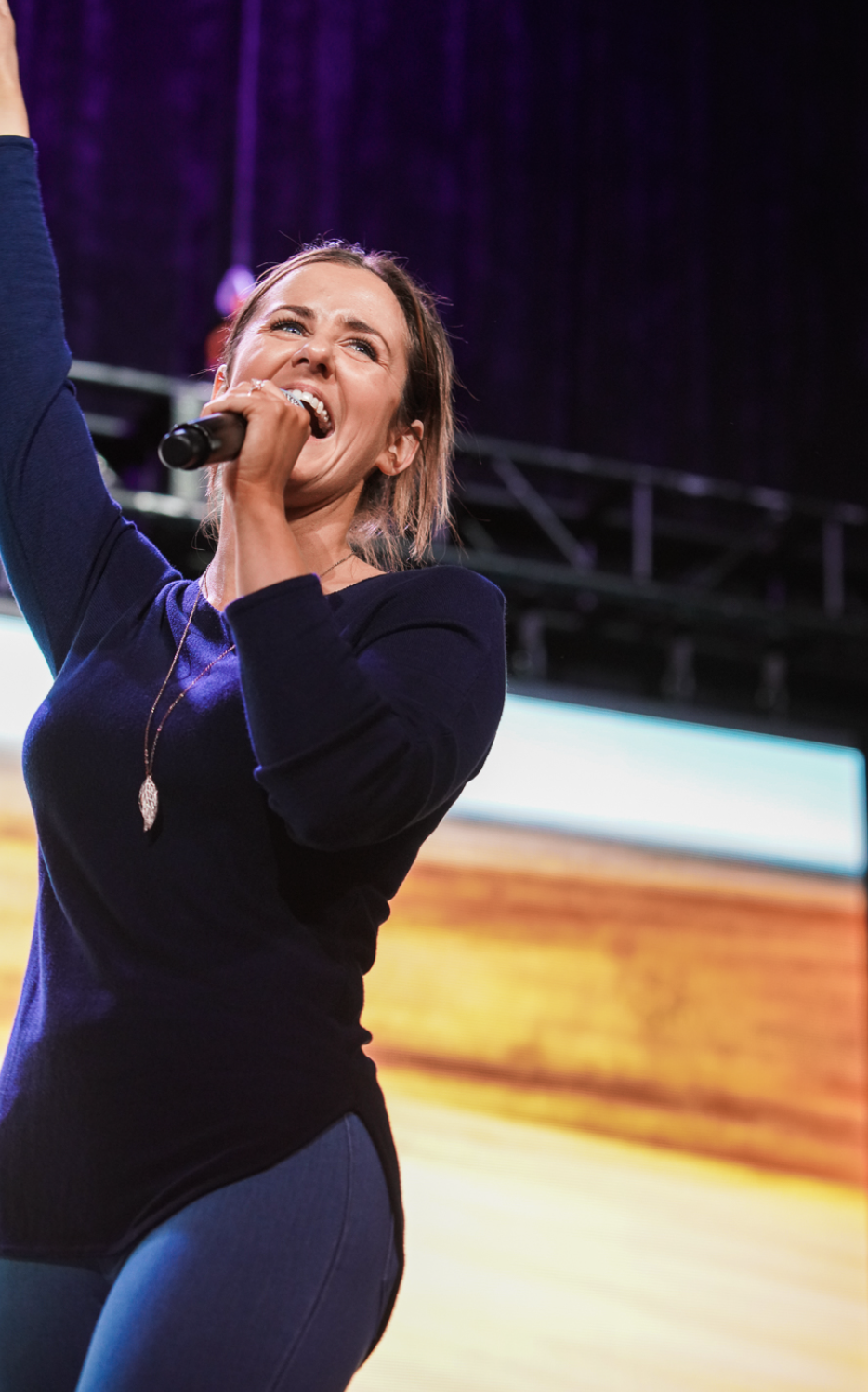 Resilience speaker Kate Gladdin interacts with audience from stage