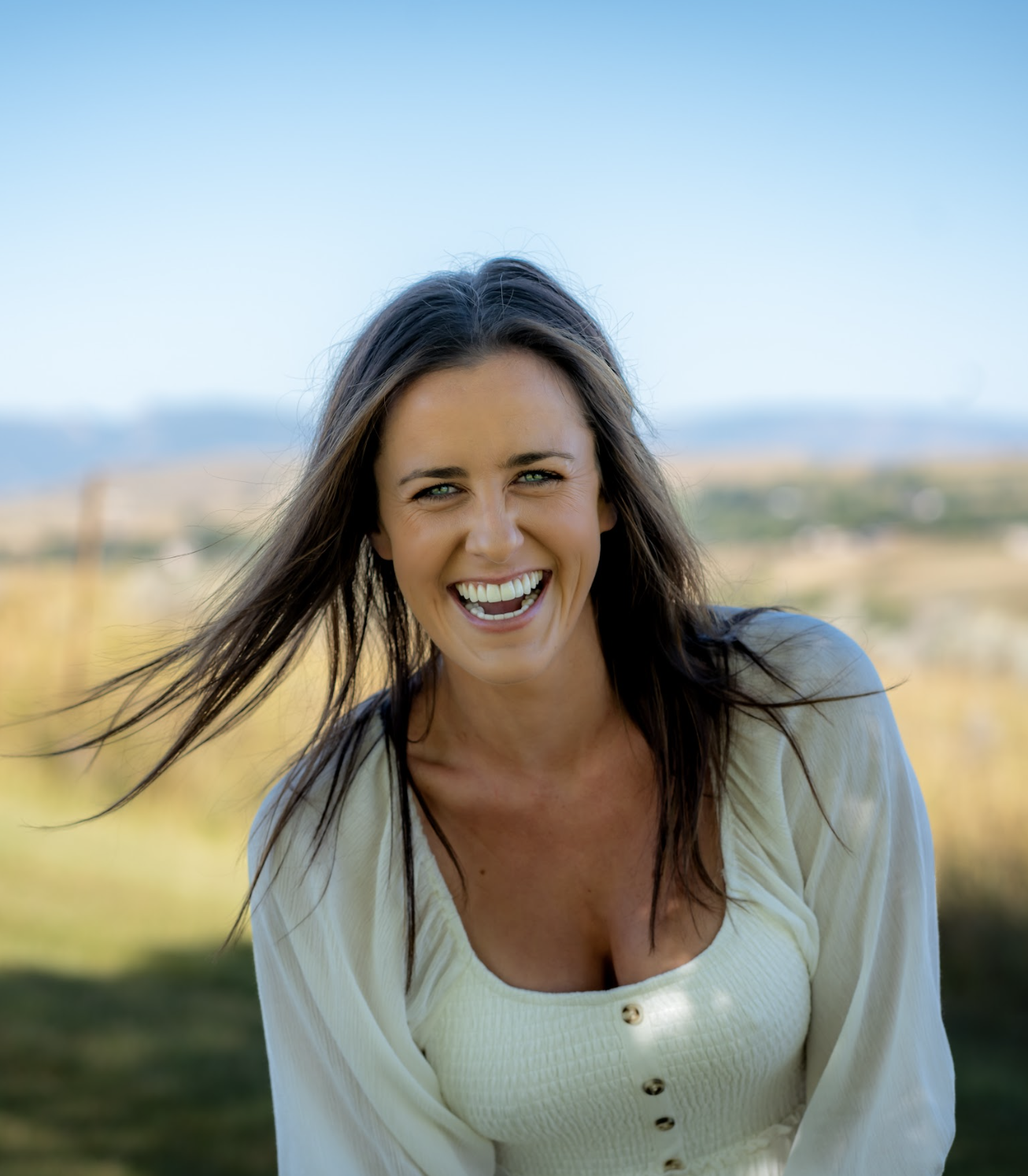 Resilience in the workplace speaker Kate Gladdin smiles at the camera