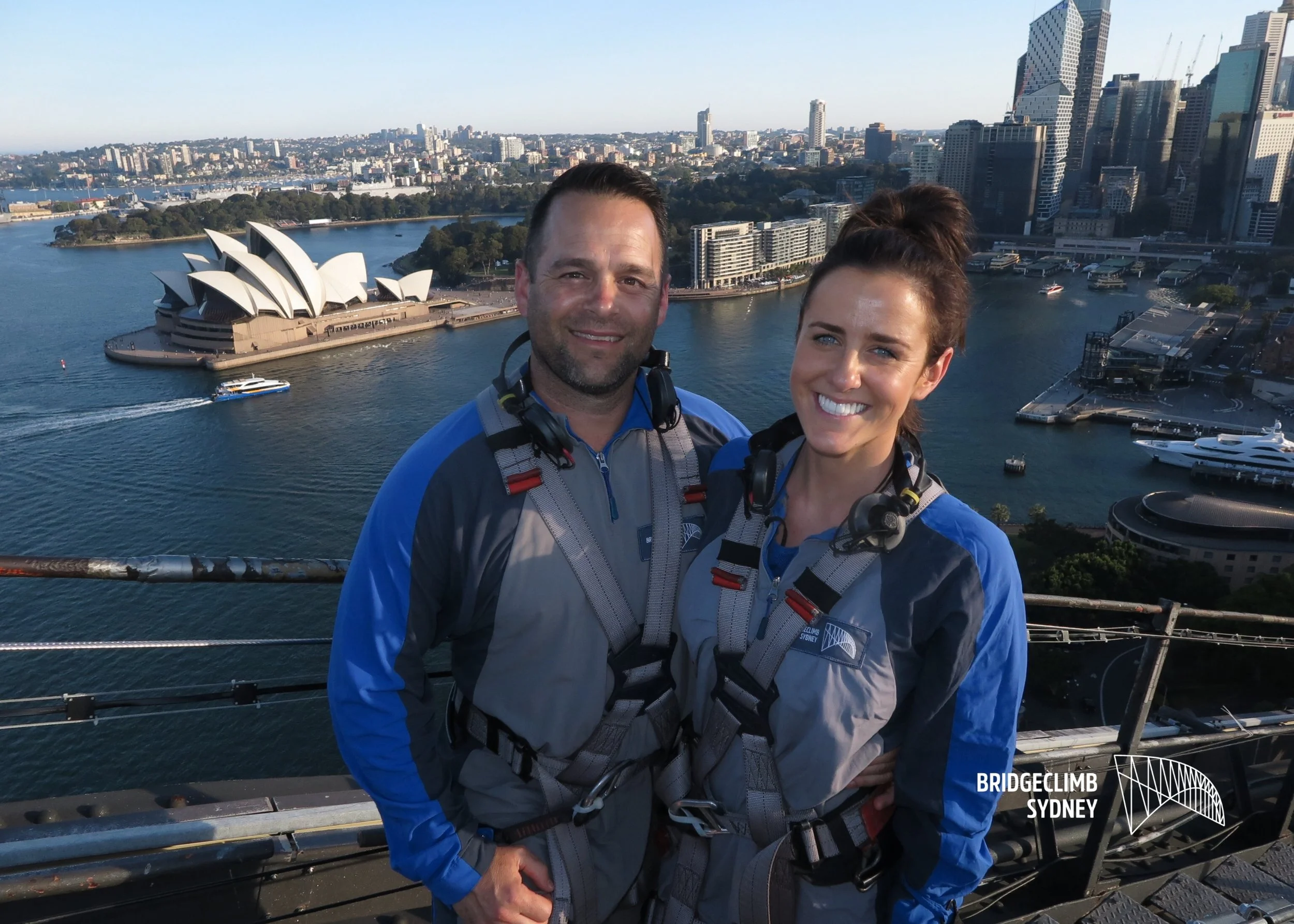 Resilience trainer and speaker Kate Gladdin with her husband Nate on the top of the Sydney Harbour Bridge