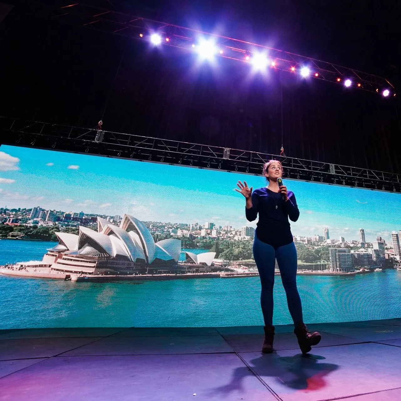 Resilience speaker Kate Gladdin speaks on a large stage