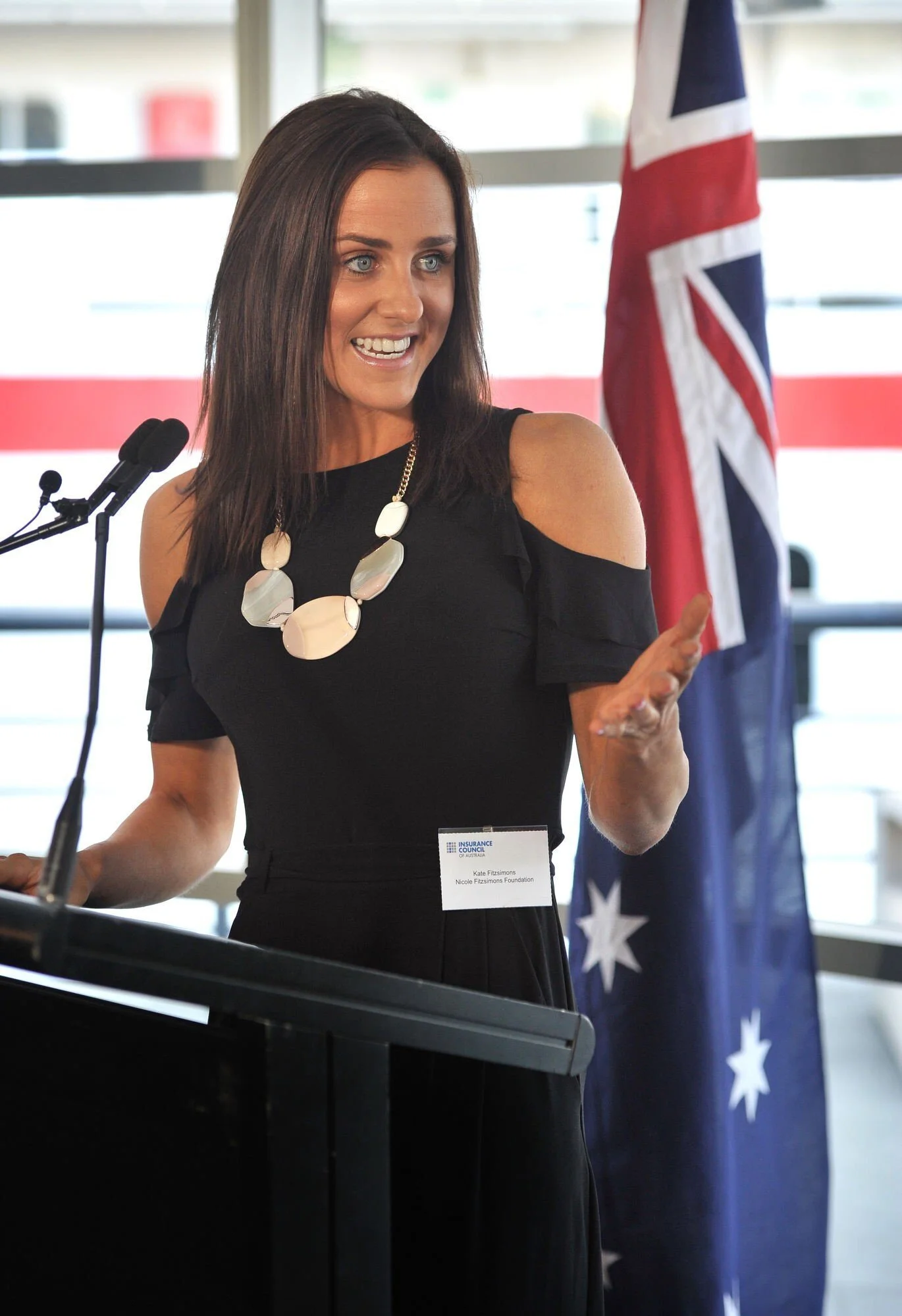 Resilience coach and speaker Kate Gladdin speaks from a podium