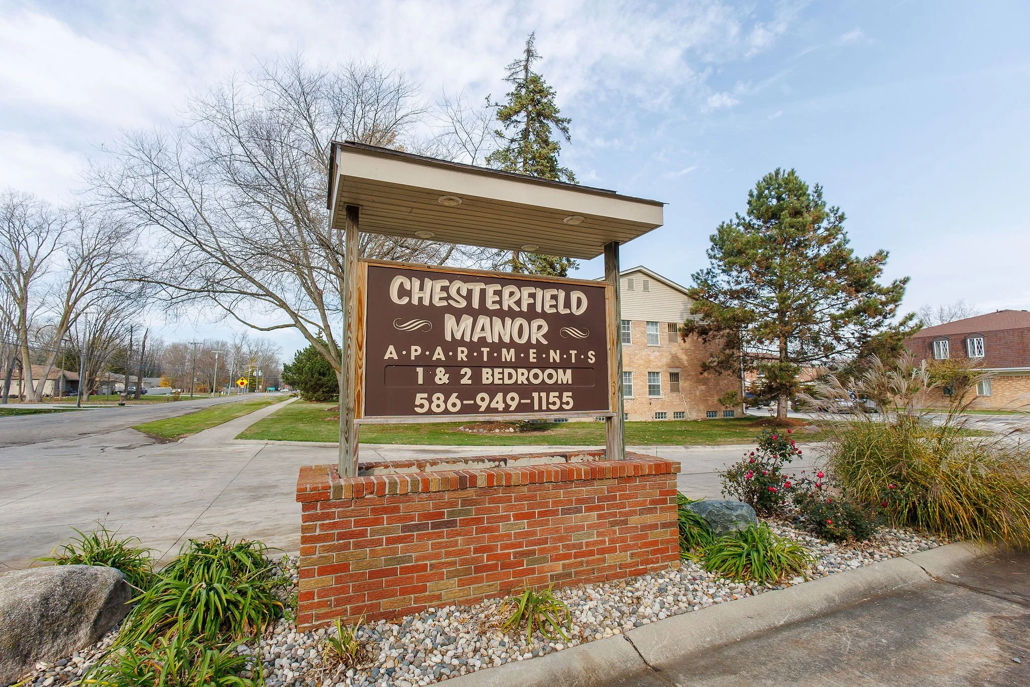 Sign for Chesterfield Manor Apartments with contact number