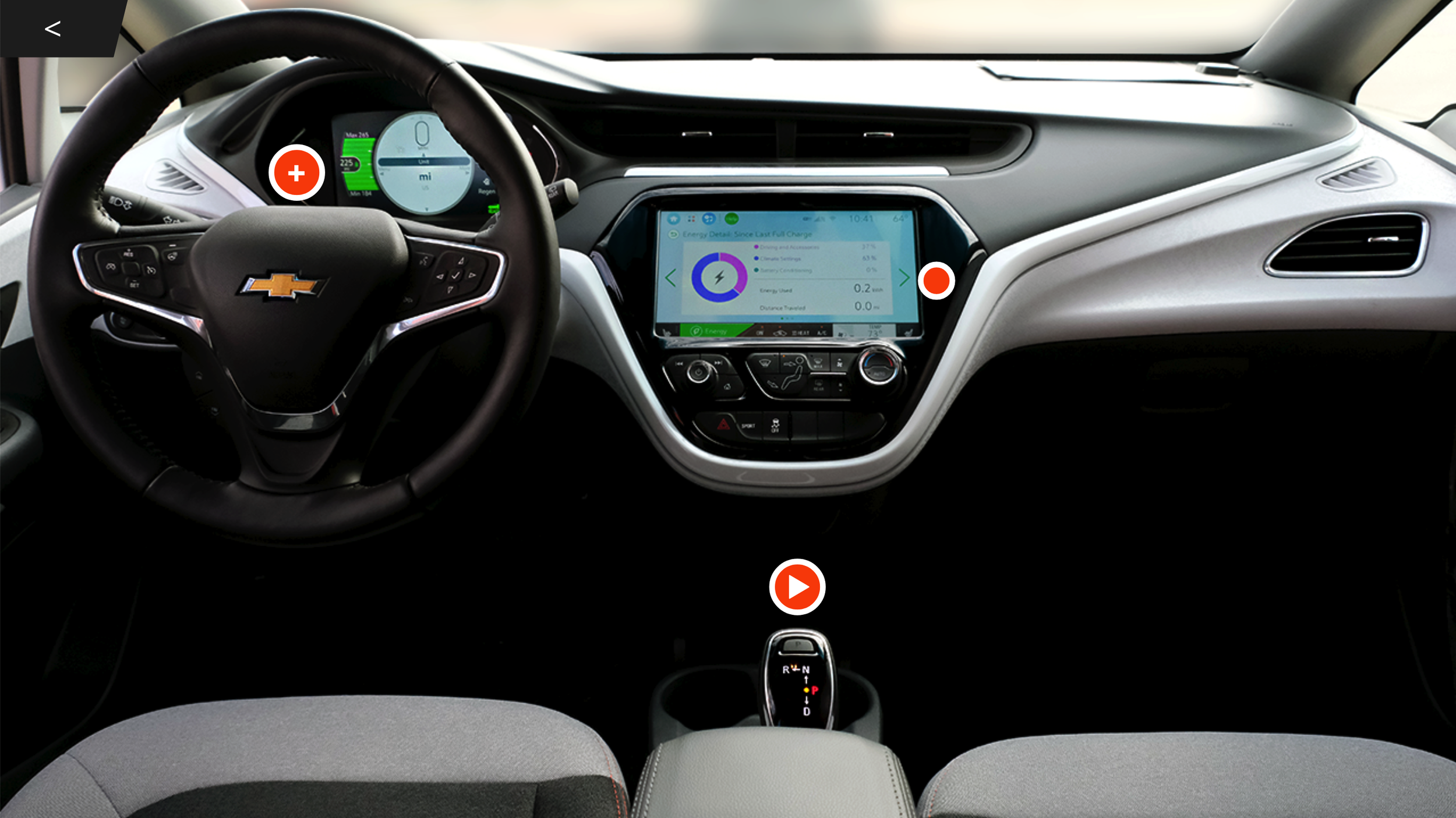 Interior view of a Chevrolet electric vehicle dashboard with a steering wheel, digital instrument cluster, touchscreen display, and gear shift.