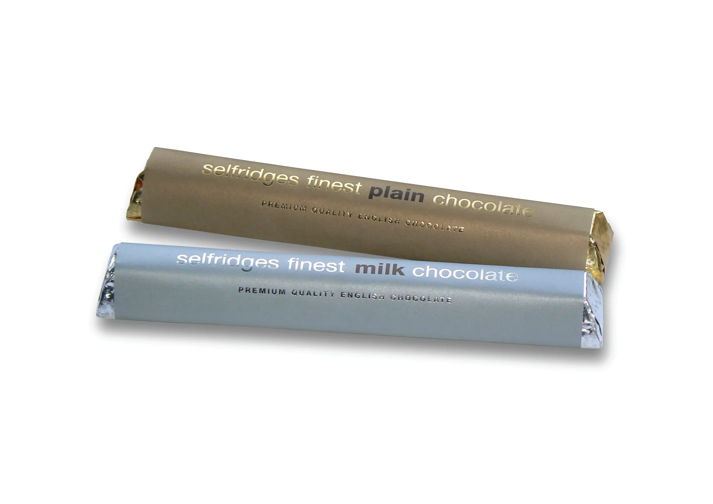 Two bars of Selfridges English chocolate, plain and milk, wrapped in gold and silver foil.