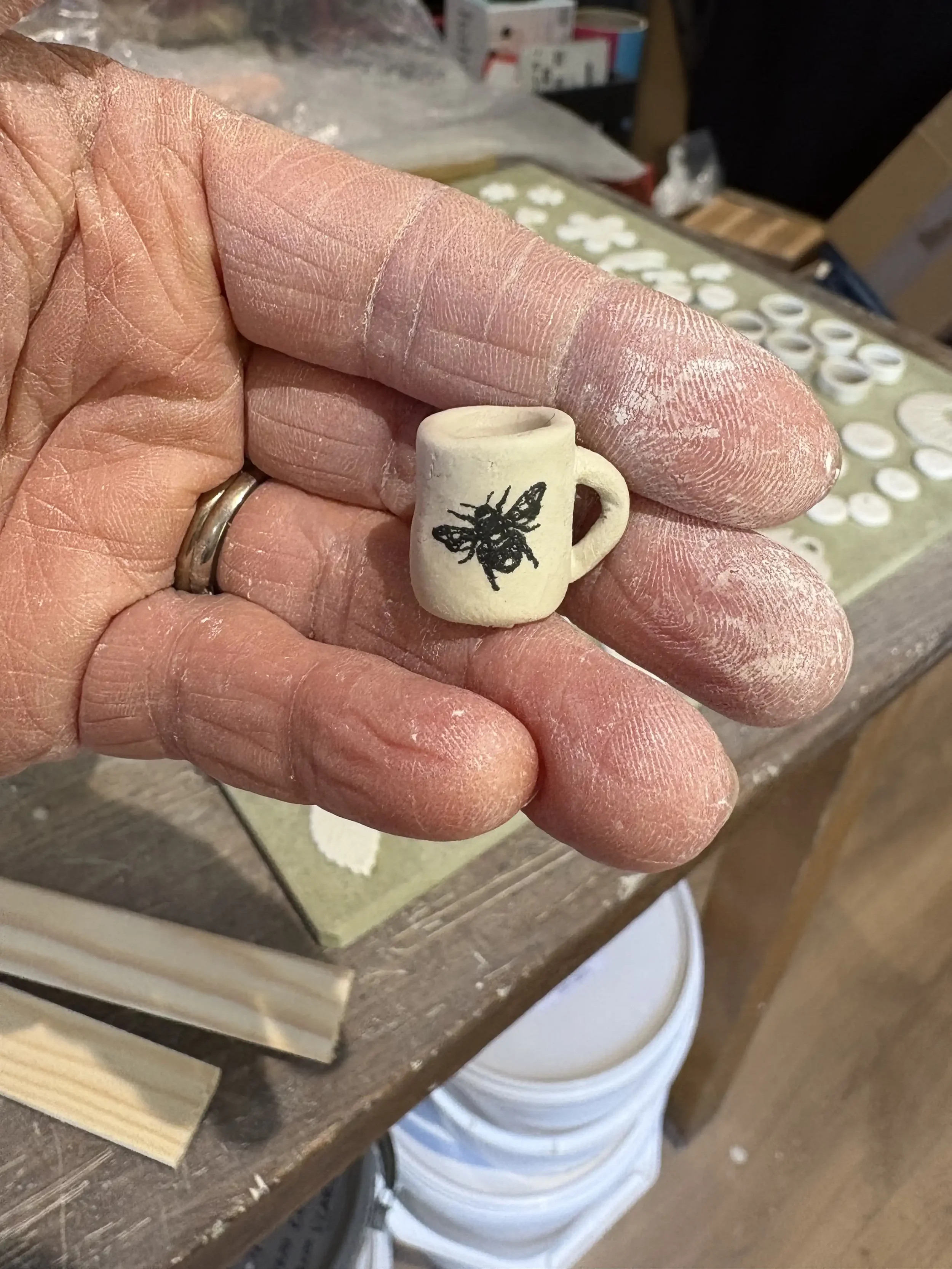 Teeny handmade porcelain cup with bee.
