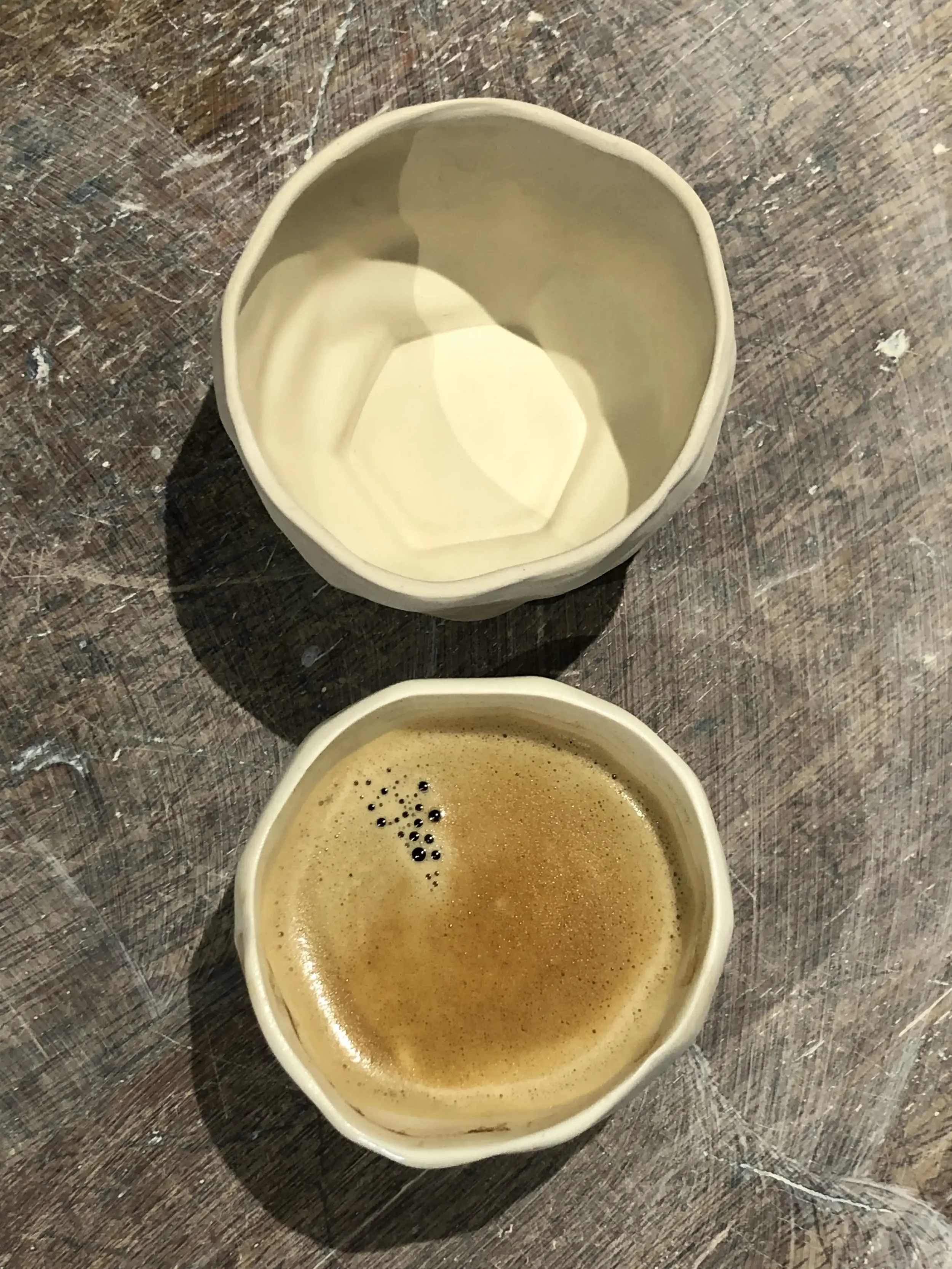 Shrinkage comparison between unfired porcelain at the top and finished cup at the bottom!
