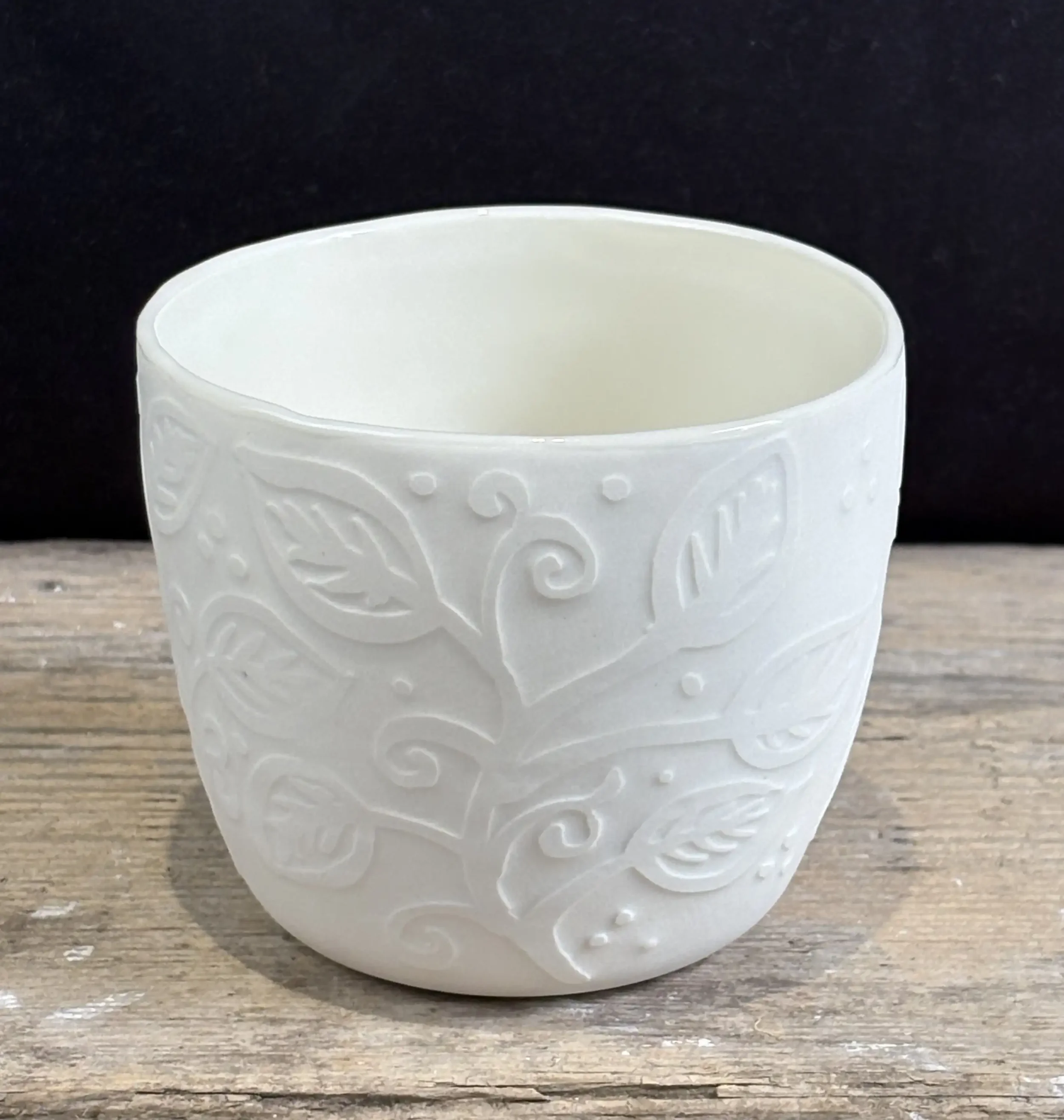 Water-etched slip-cast porcelain cup.