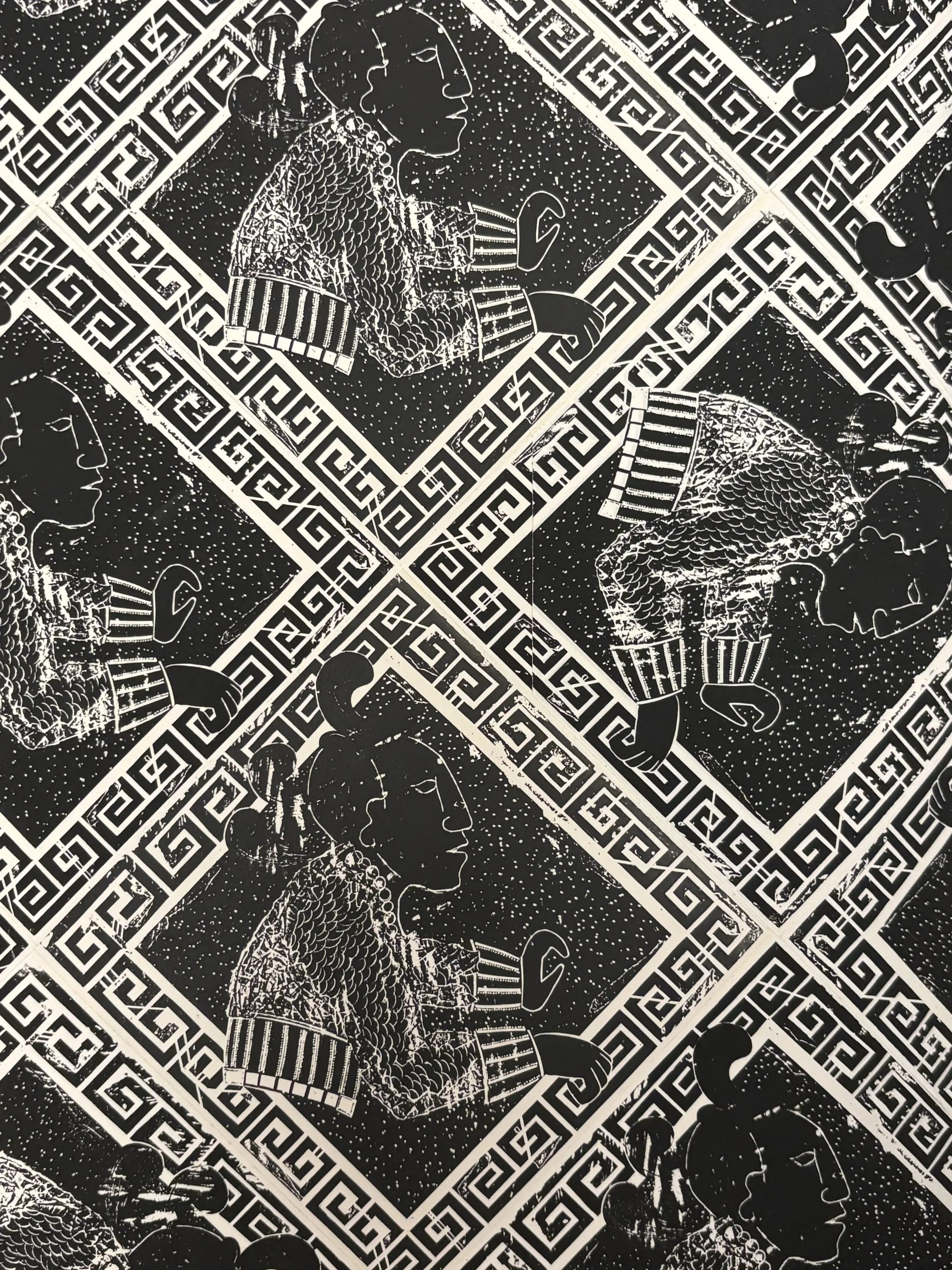 Pattern with black and white illustrations of a person surrounded by geometric borders.