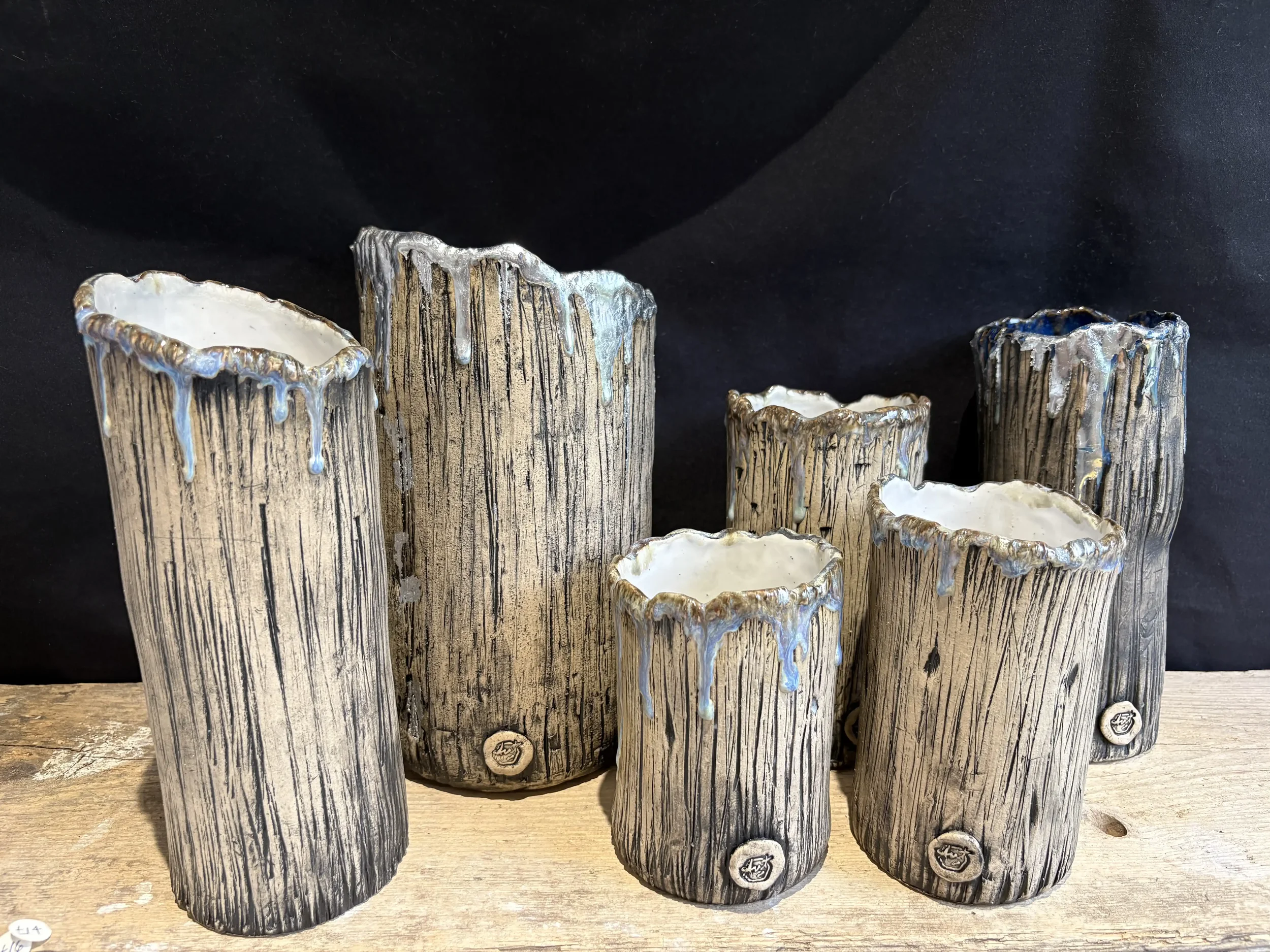Group of ceramic vessels with tree bark texture and 'frosted' glazing forming the 'Winter Wonderland' collection.