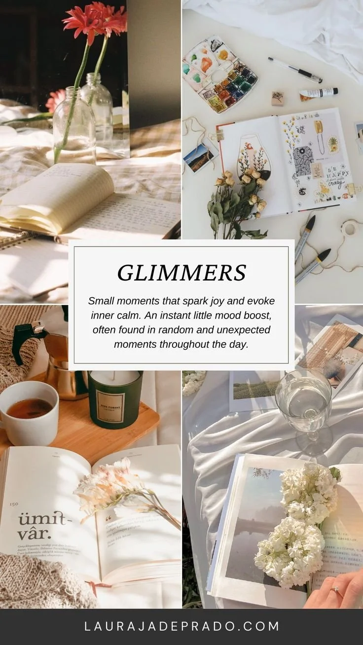 Collage of four images featuring cozy and artistic moments. The first image shows a notebook open in sunlight with pink flowers in glass bottles. The second image is a workspace with art supplies, a sketchbook, and dried flowers. The third image displays a morning scene with an open book, a cup of tea, and a candle on a bedside table. The fourth image features an open book, a glass of water, and white flowers on a bed or table. In the center, there is a quote about small moments that spark joy.