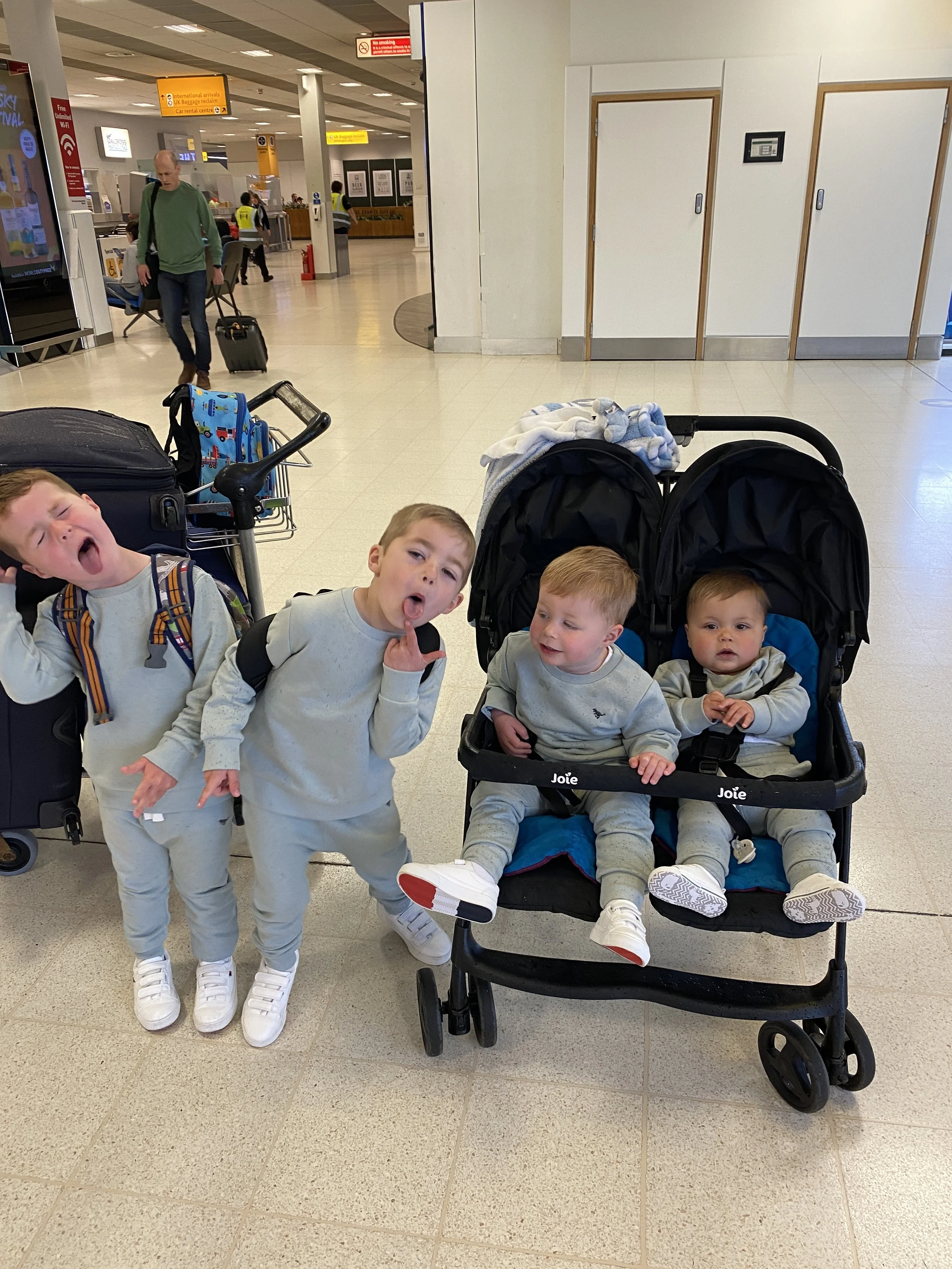 Kids at the airport preparing for a trip, representing family travel adventures