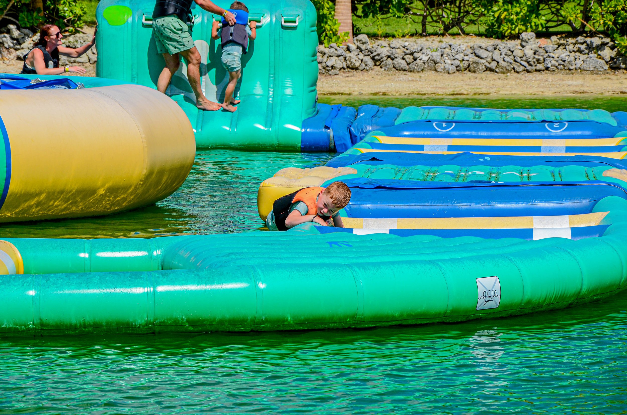 Child on the assault course at Caribbean Lake Park in Punta Cana
