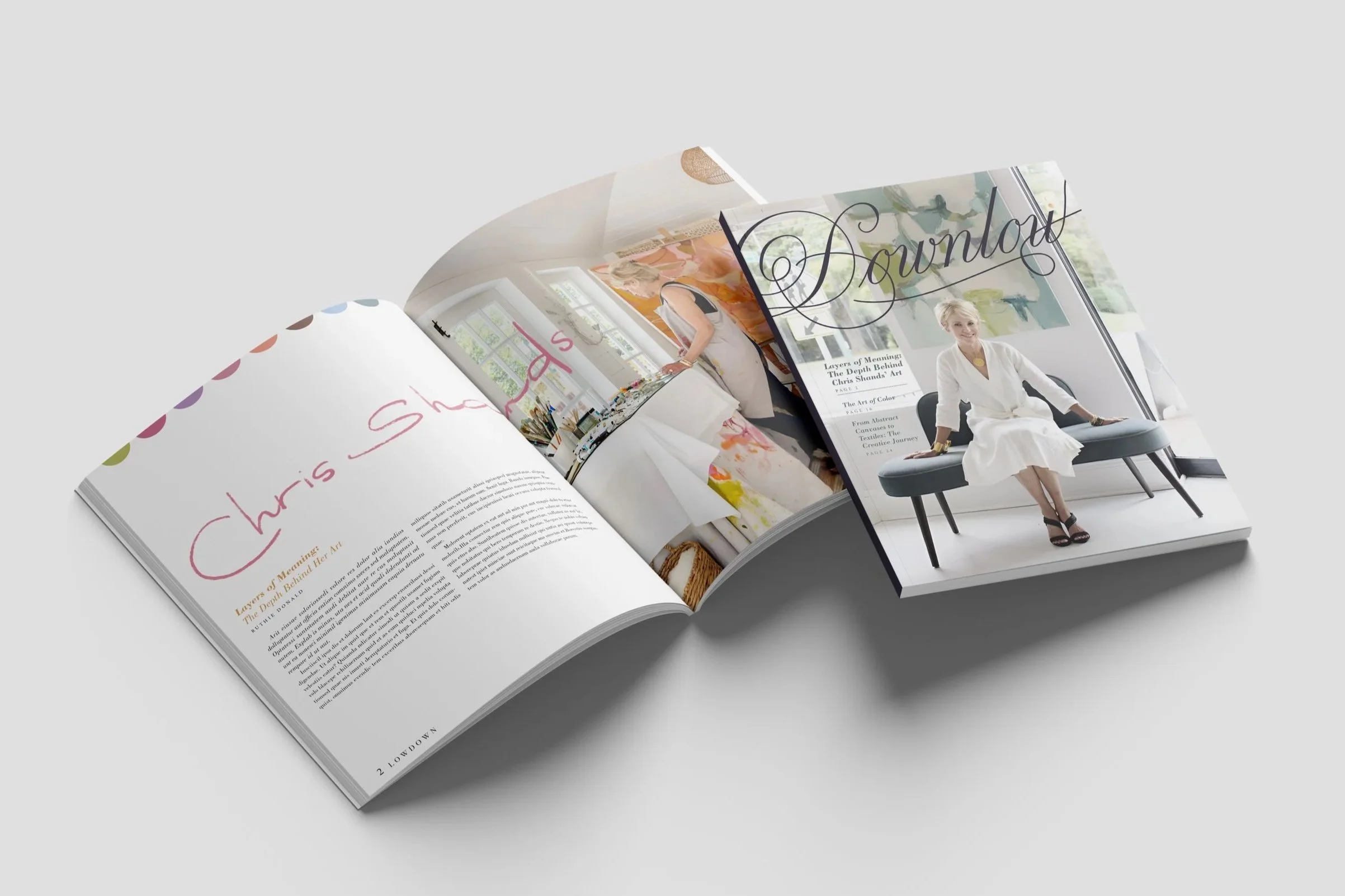 Cover of Downlow magazine featuring a woman in a white dress seated in a bright, modern room, along with a magazine spread with large artistic typography spelling ‘Chris Shands’ alongside a photo of the artist working in her studio.