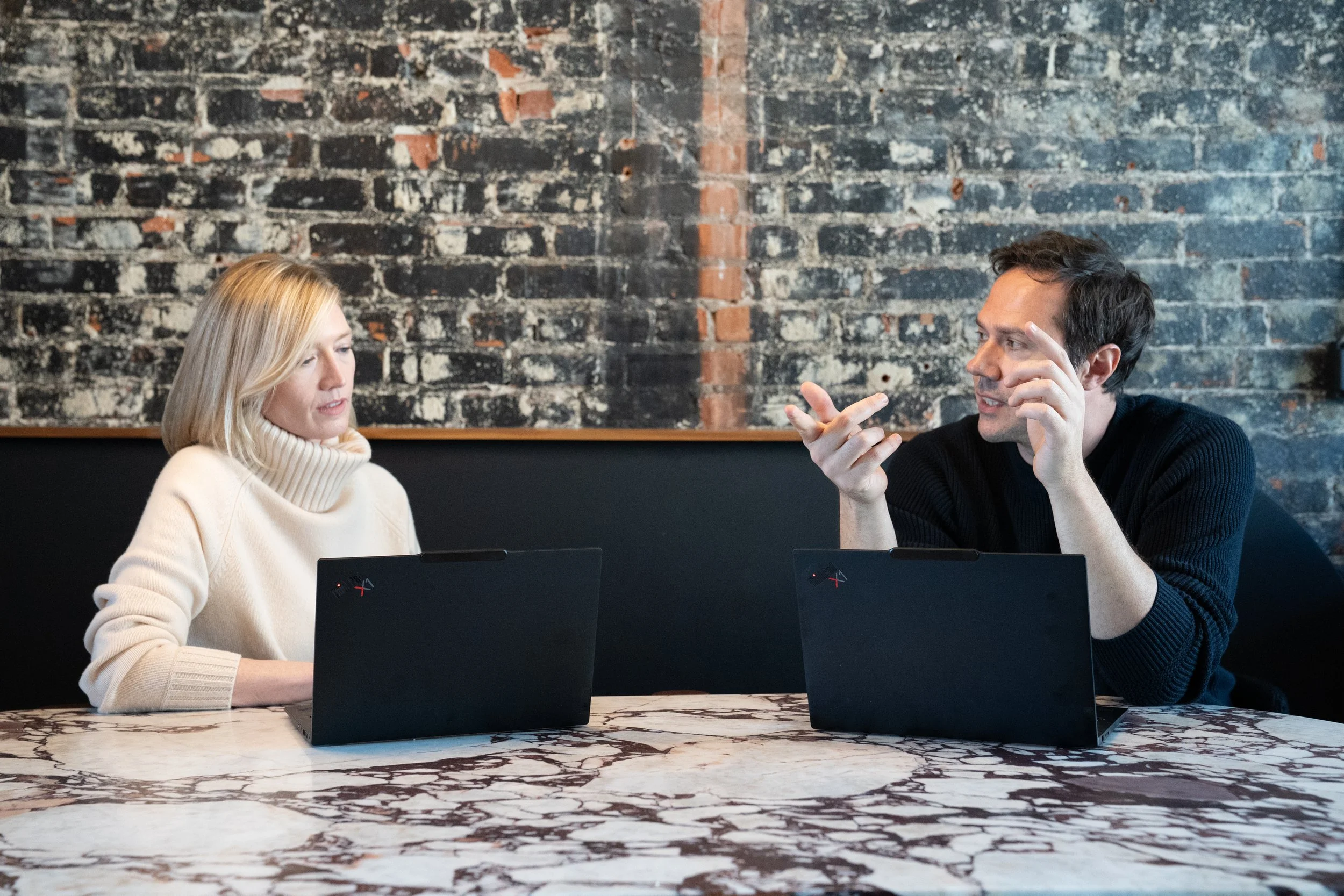 Rebecca Tierney and Chris Koepsel collaborating on divorce mediation and co-parenting solutions.