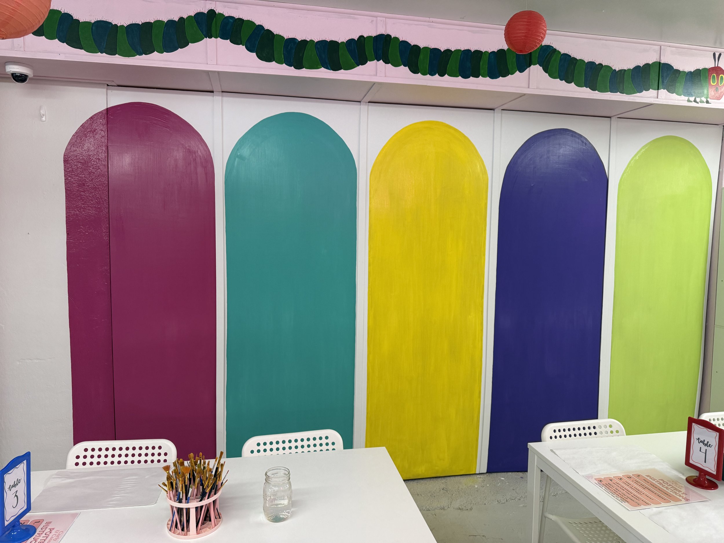 Arched dividers created for bookshelves in Carly & Cass DIY Studio.