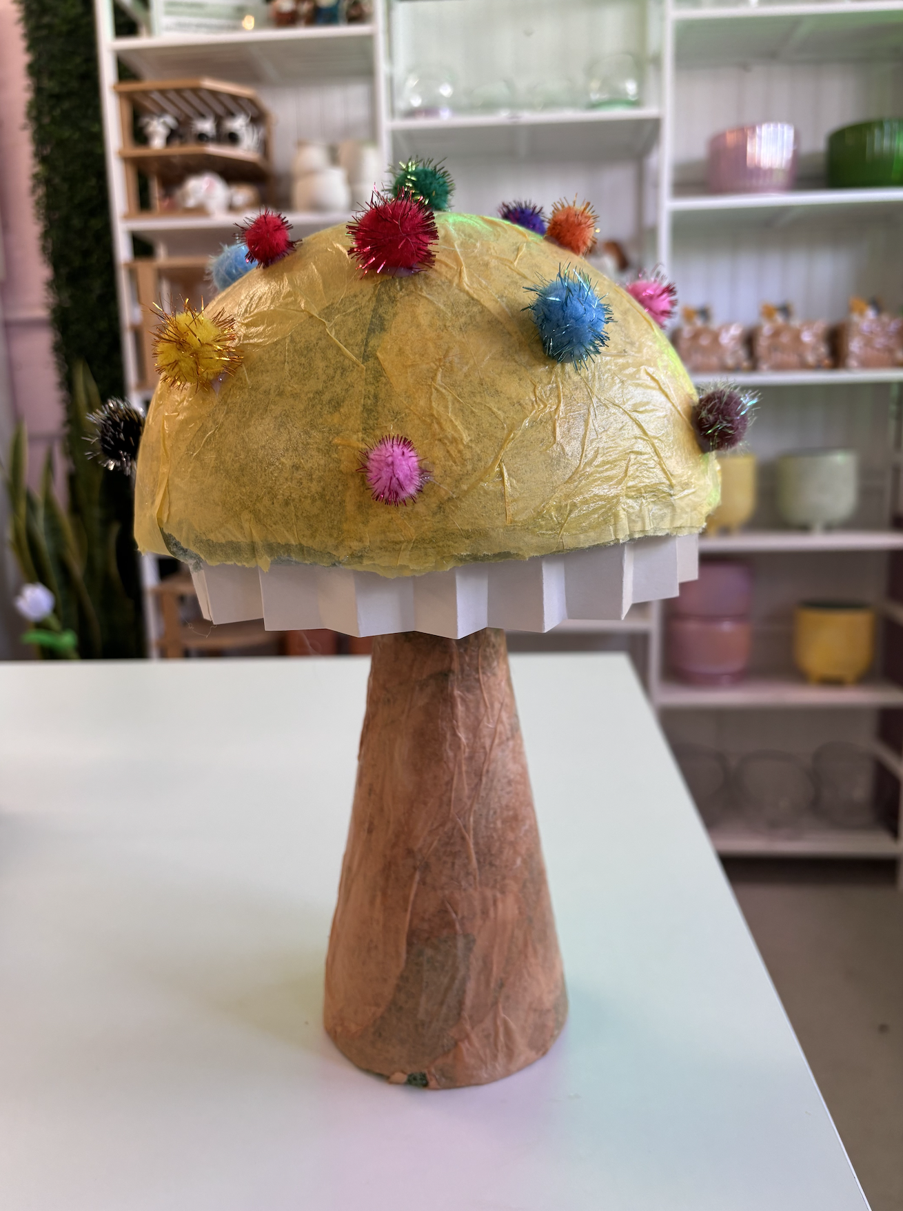 Whimsy mushroom made for front window display at a DIY Studio.