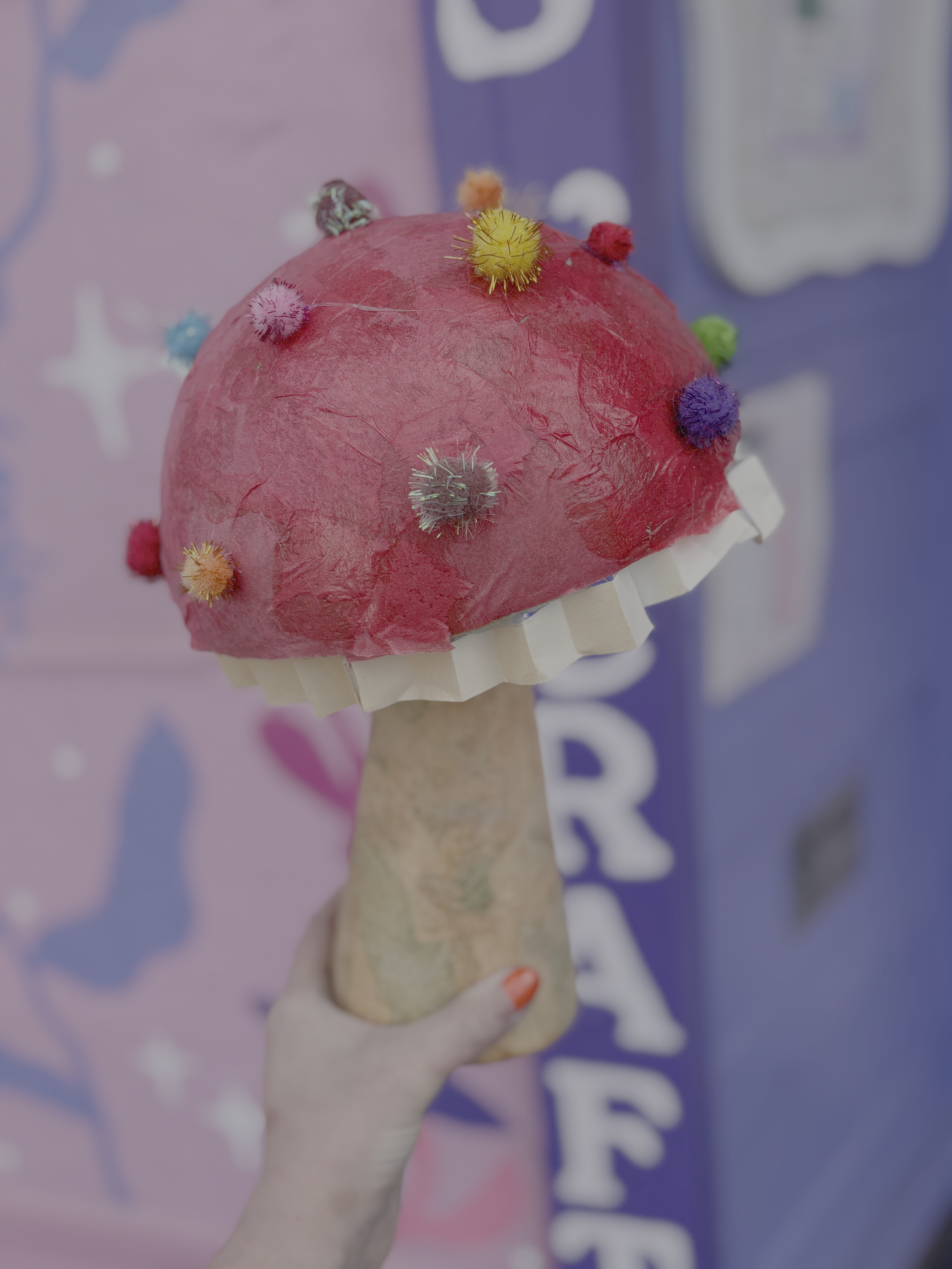 Whimsy mushroom made from foam, tissue paper, pompoms, mod podge and hot glue.