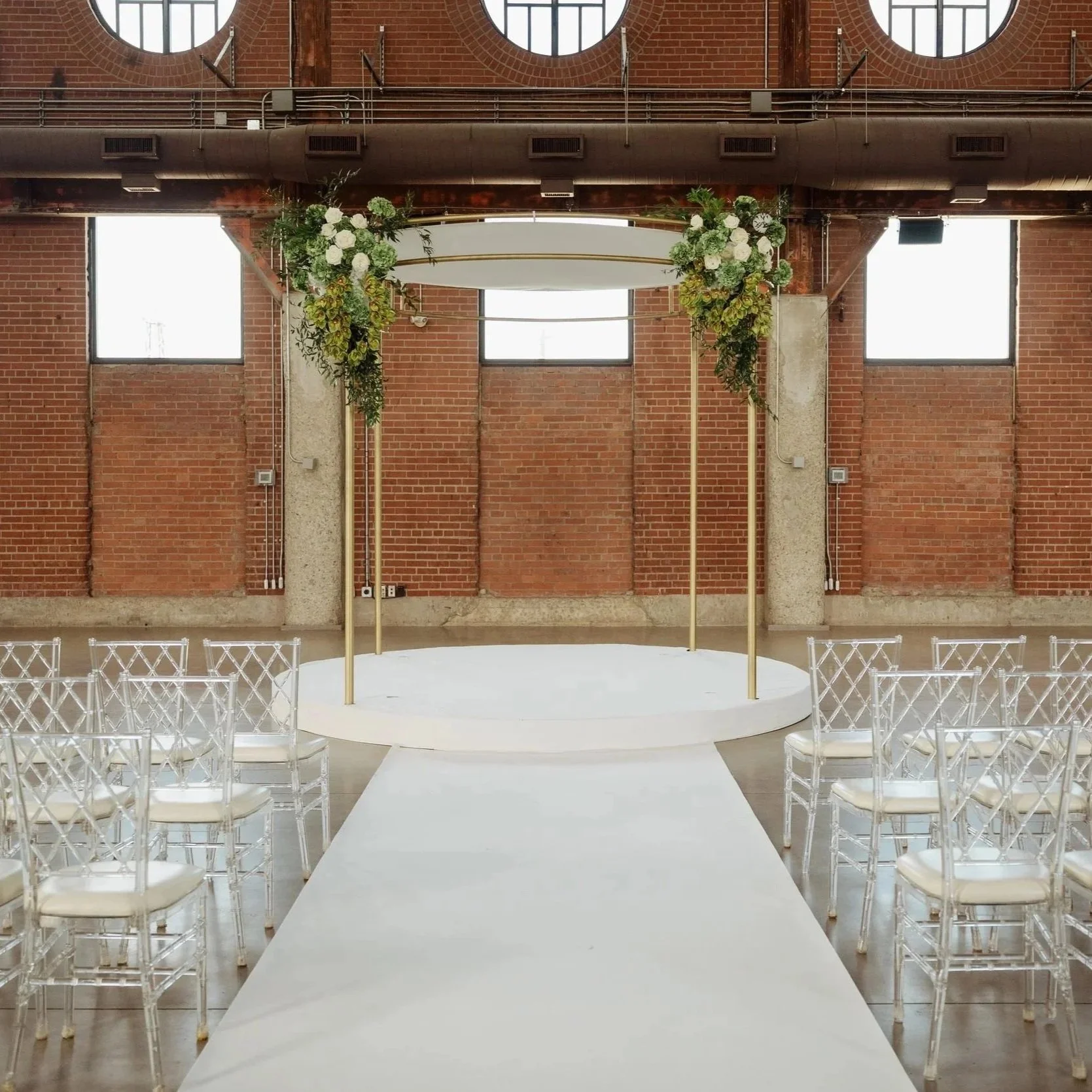 ORBIT circular chuppah with integrated white stage and overhead draping