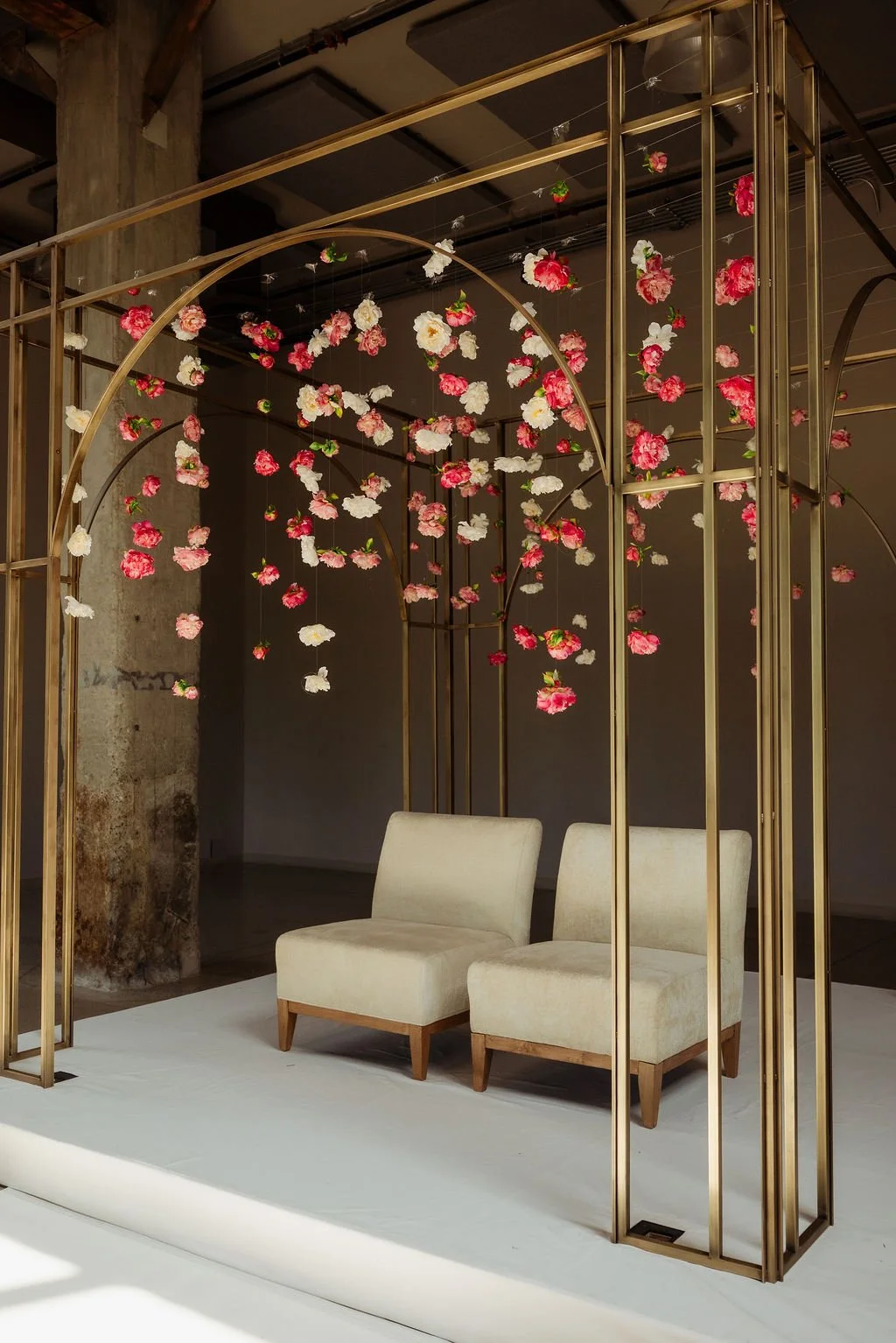 Pavilion freestanding ceremony structure featuring layered arches and aged brass finish