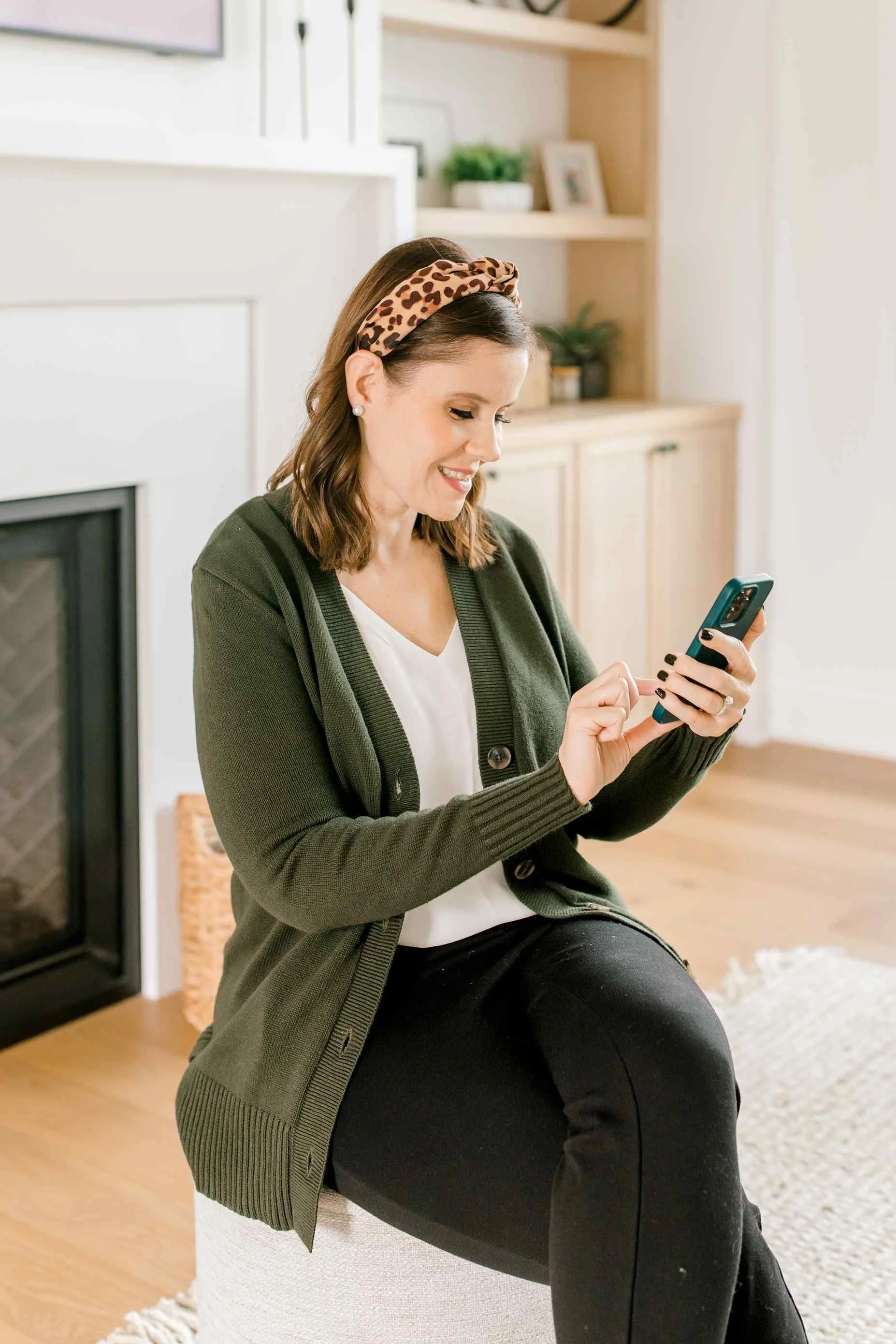 Heather, a Holland, Michigan realtor, relaxing in a cozy living room.