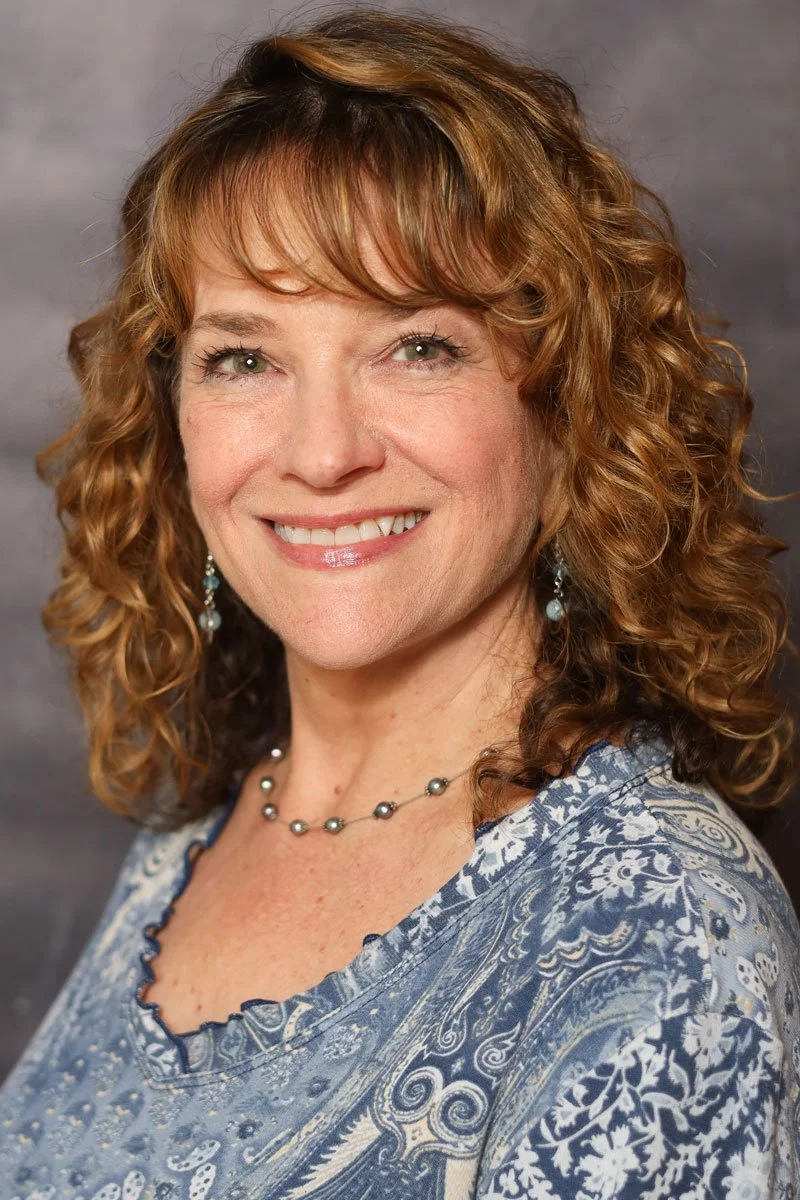 Headshot of a Brenda Robson,  award winning artist and Professor of Art at The Cambridge School of Dallas, the top ranked classical Christian prep-school in DFW according to Niche.