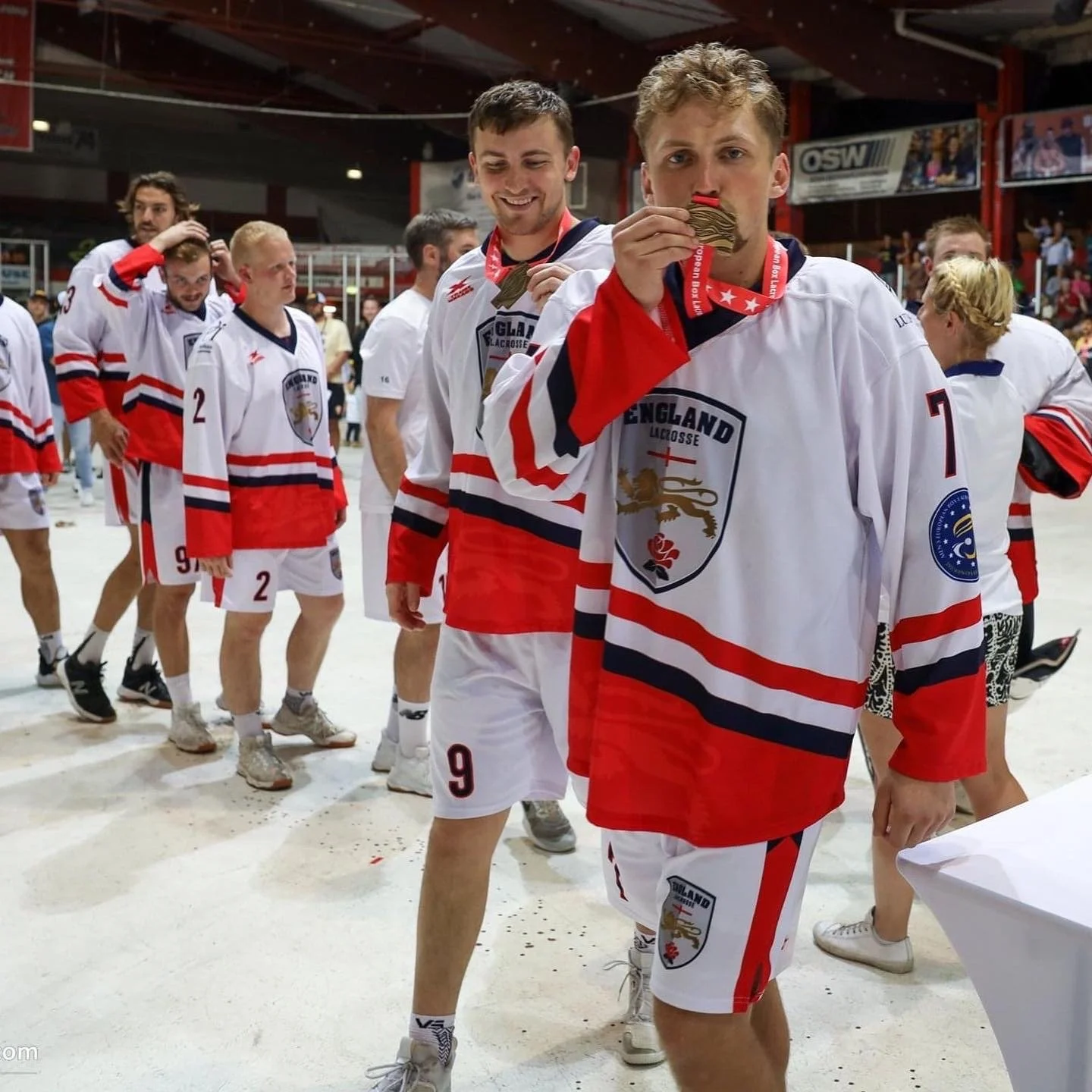 England lacrosse team celebrating after winning a gold medal at the European Championships.