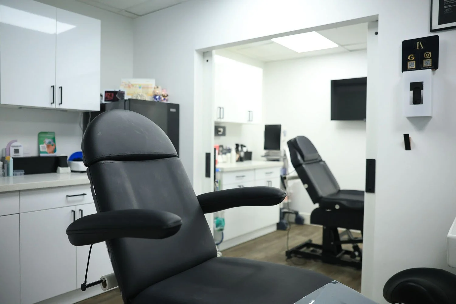Modern PRF treatment room with black leather chair at Impeccable Aesthetics med spa in Honolulu