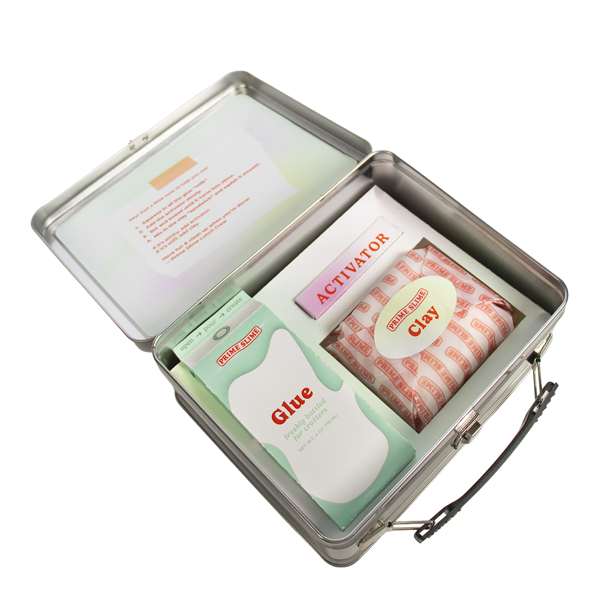 A metal box contains slime making supplies, including a packet labeled 'Clay,' a box labeled 'Activator,' and a packet labeled 'Glue,' with instructional paper inside the lid.