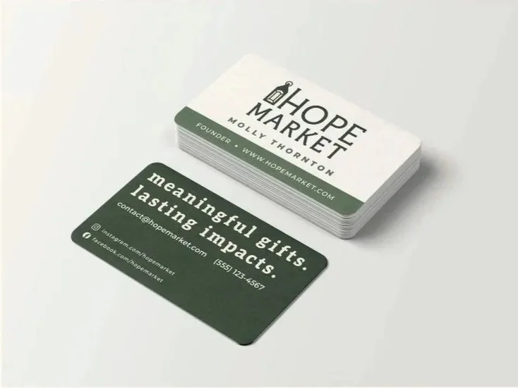 Business cards for Hope Market, featuring the logo, website, and contact information. One card reads 'meaningful gifts. lasting impacts.' and includes social media icons.