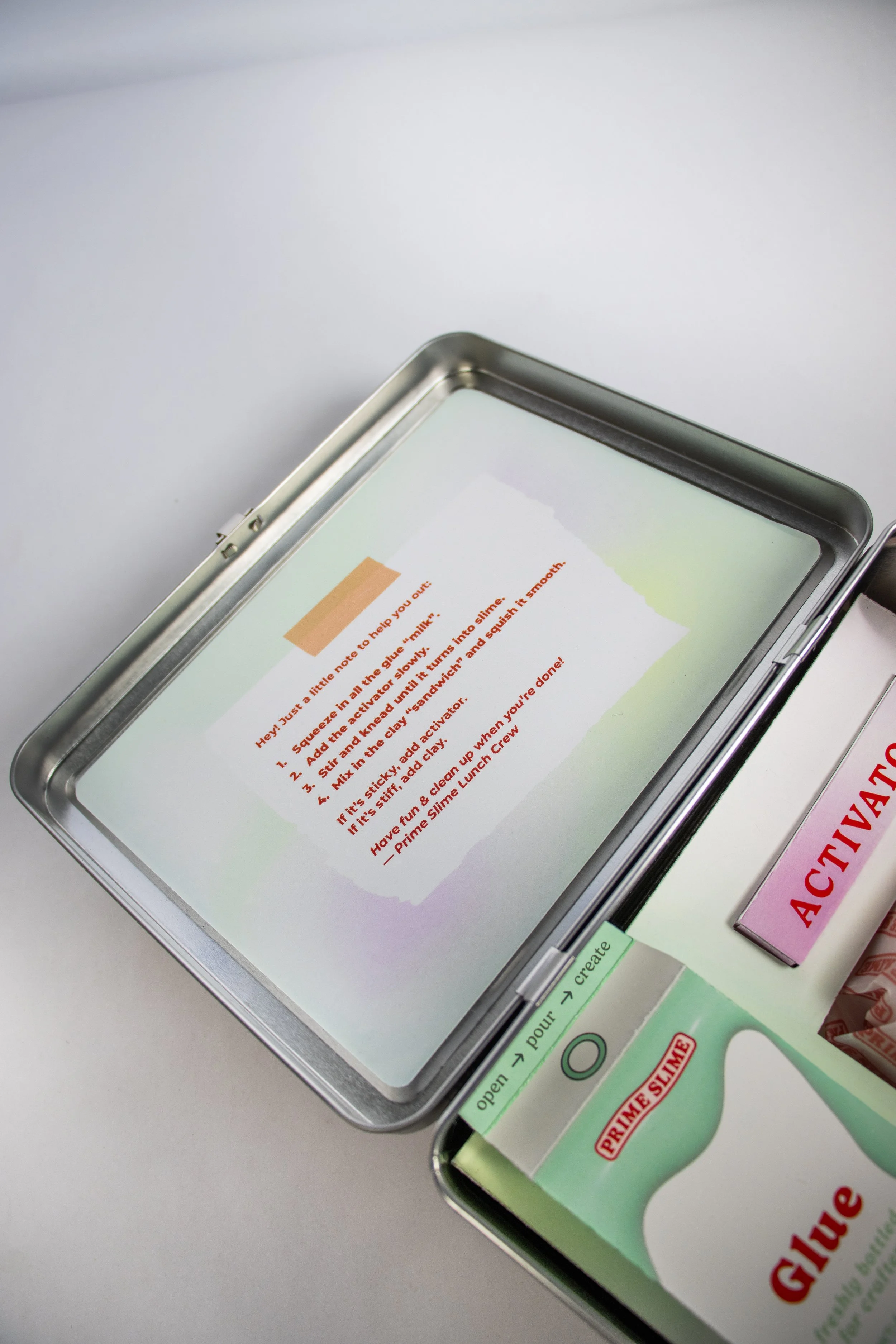 Instructions for making slime are displayed on a tablet screen.