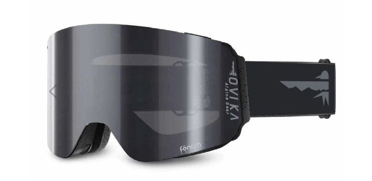 Black and gray ski or snowboard goggles with a strap that has a mountain design.