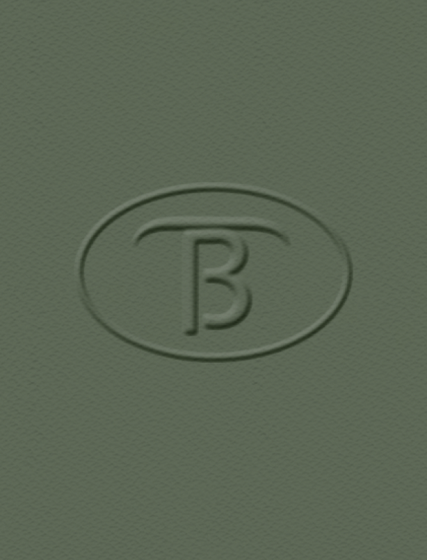 Close-up of a textured green surface with an embossed letter 'B' inside an oval shape.