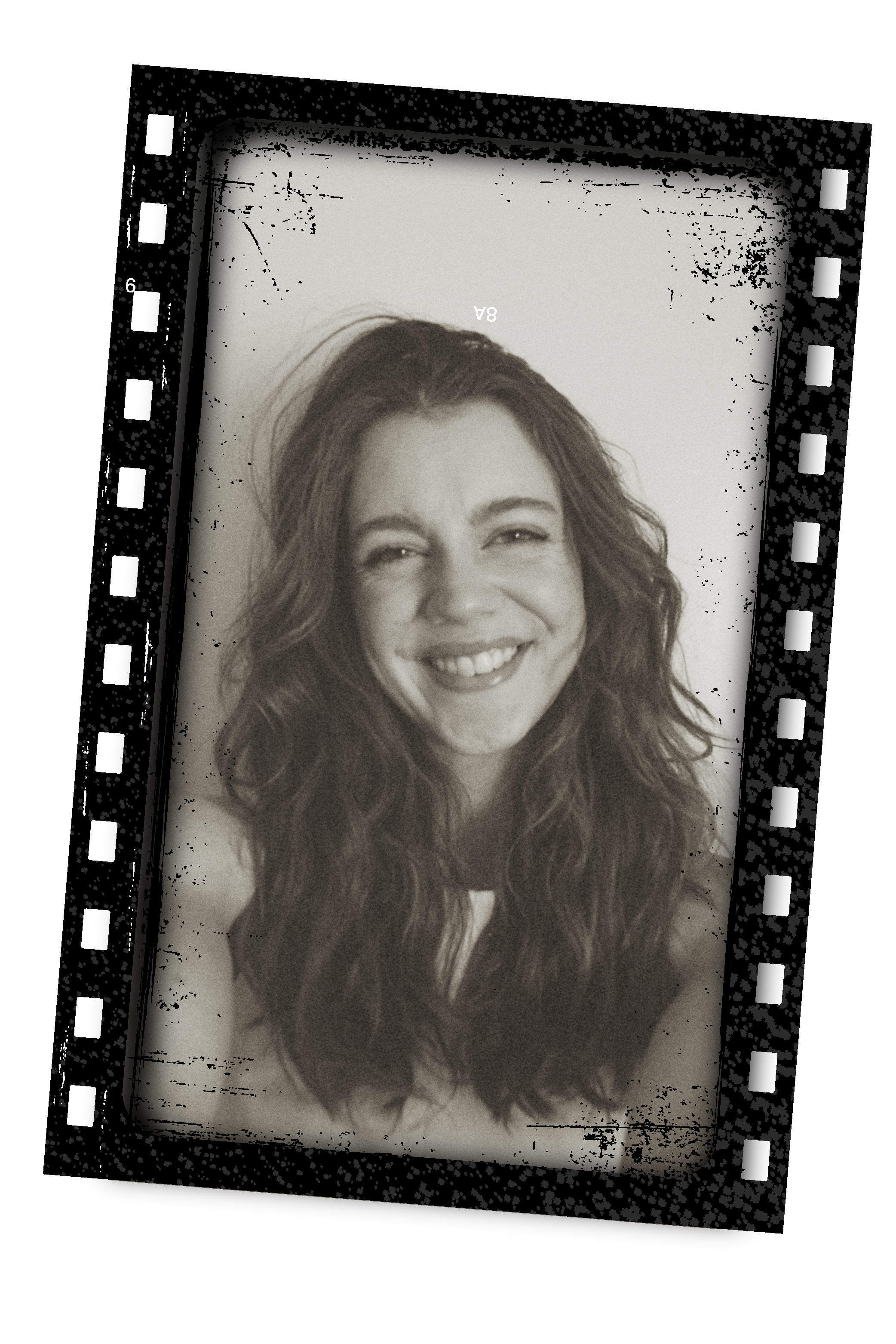 A woman with long, curly hair smiling and winking in a black-and-white photo displayed on a smartphone screen.