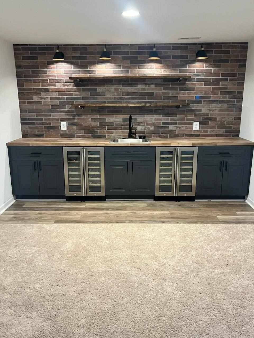 Custom built bar with backsplash, flooring and shelves