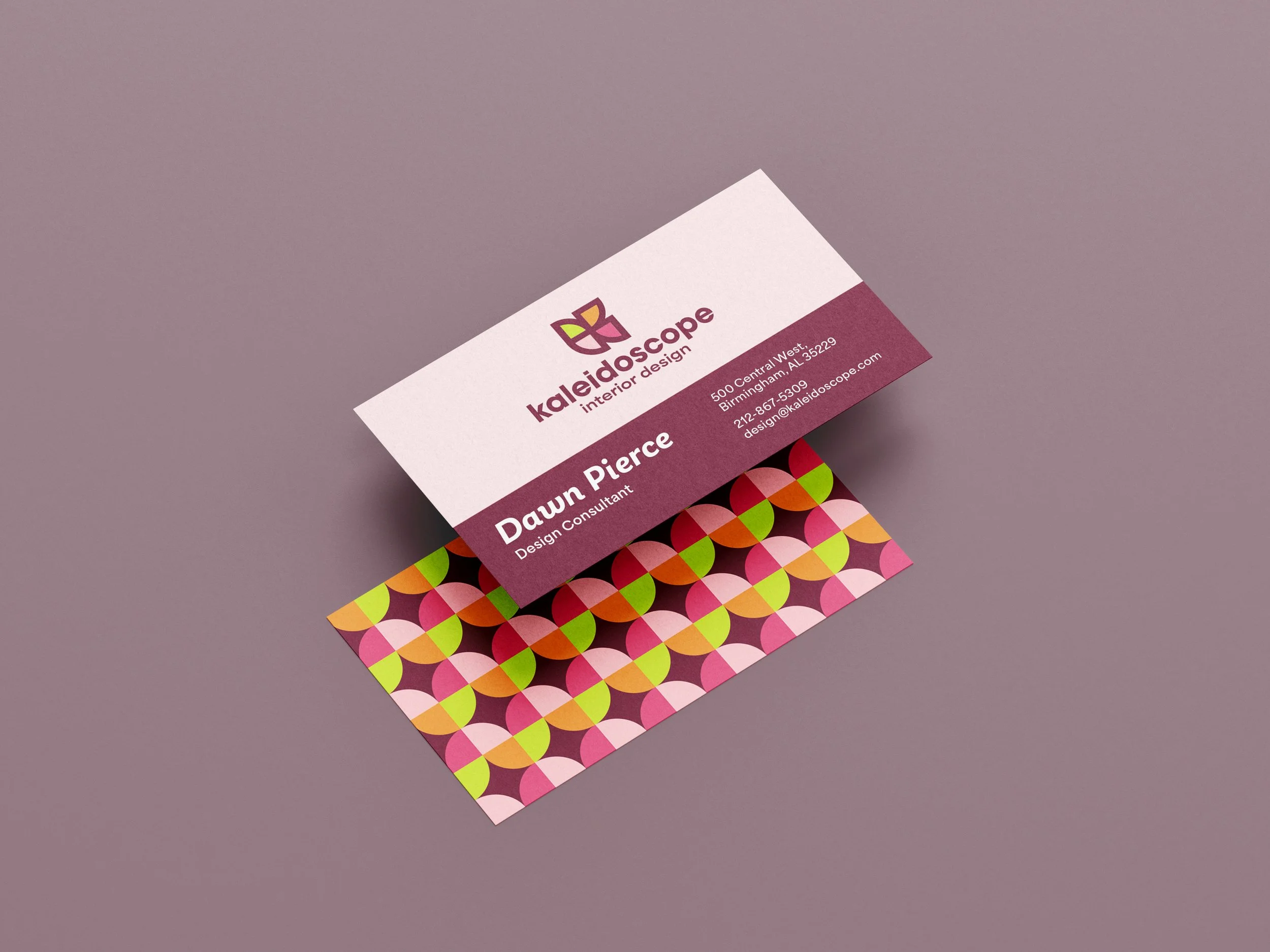 Business cards for "Kaleidoscope Interior Design" with a dark purple background