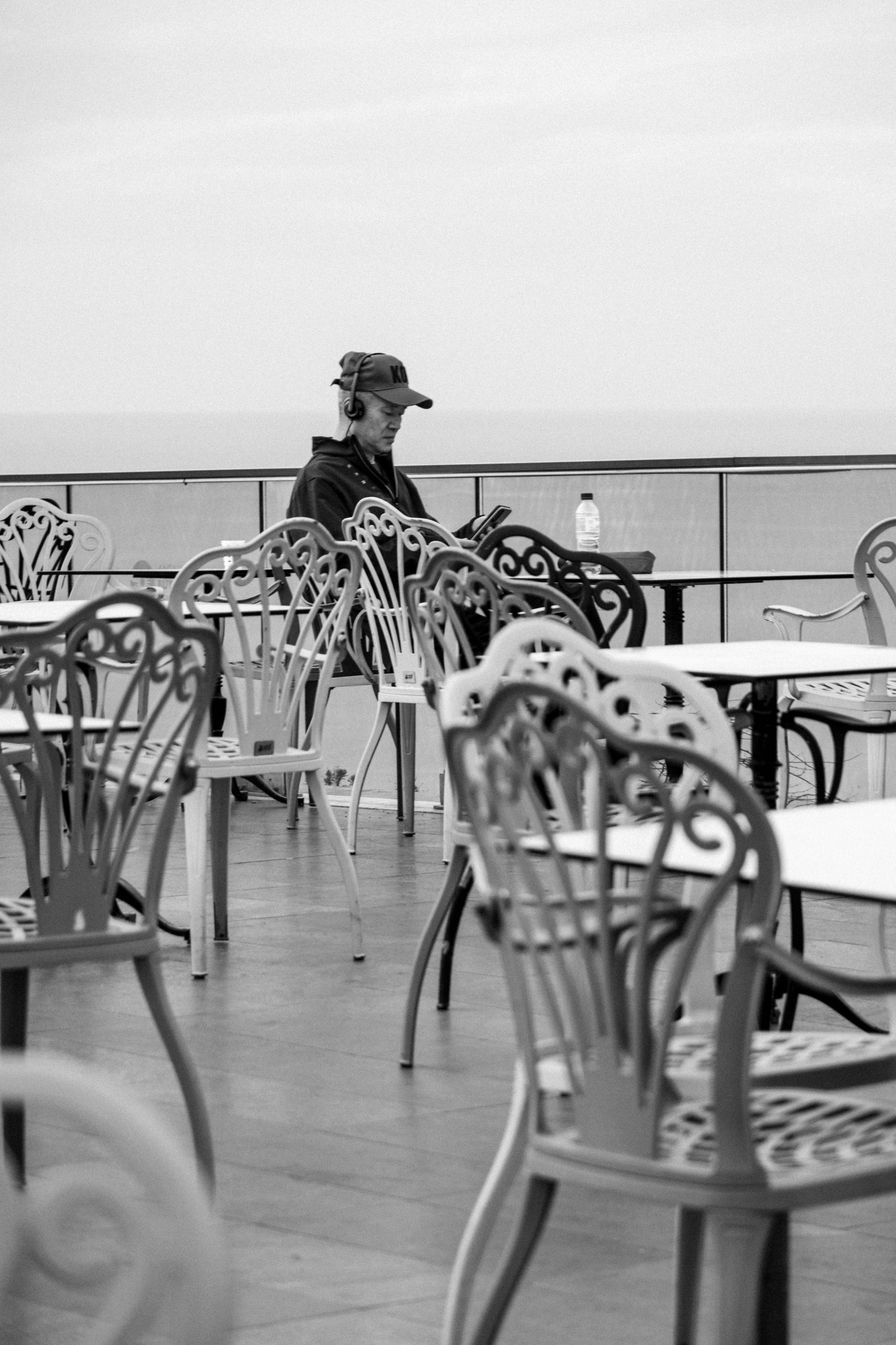 Man sitting alone among empty chairs after divorce