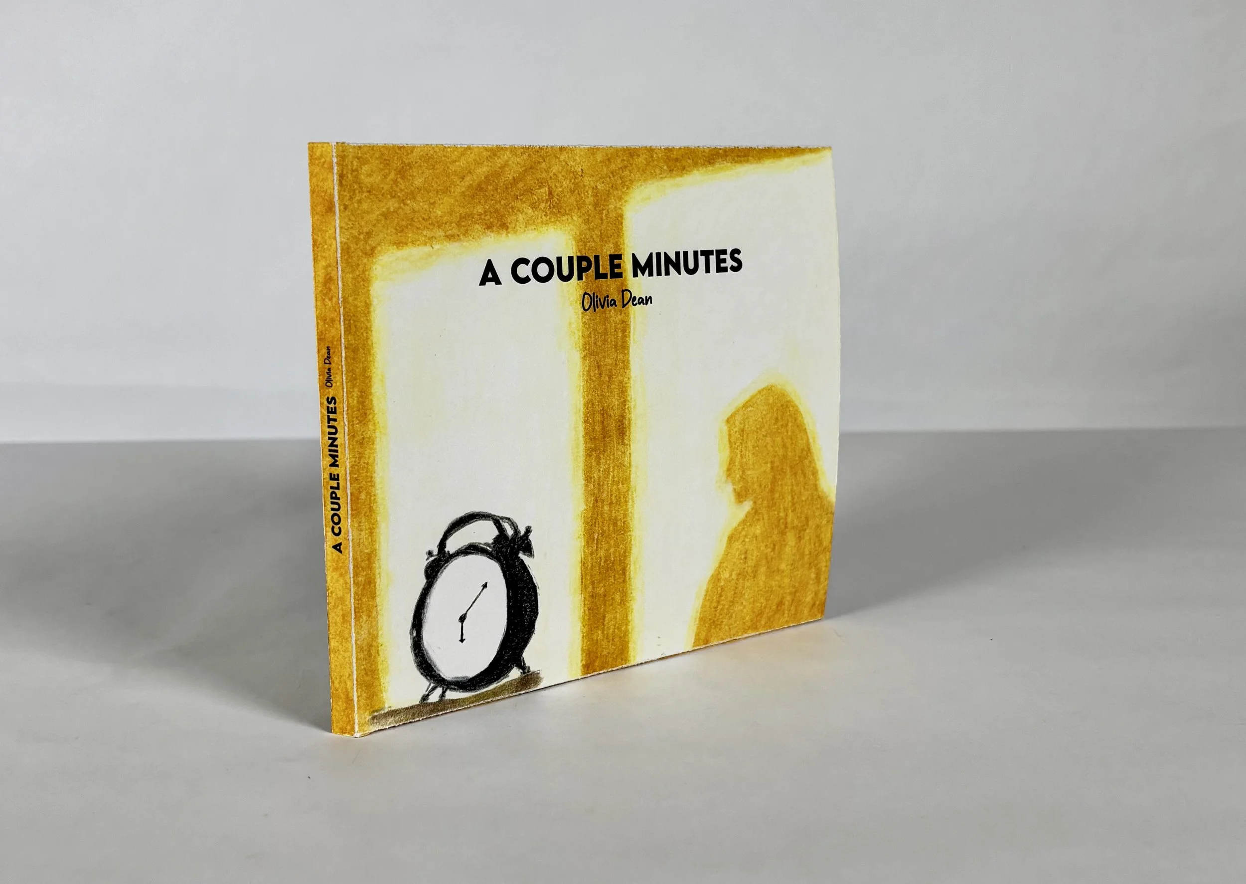 Book titled 'A Couple Minutes' by Olivia Dean, with illustration of a clock and a silhouette of a person on the cover