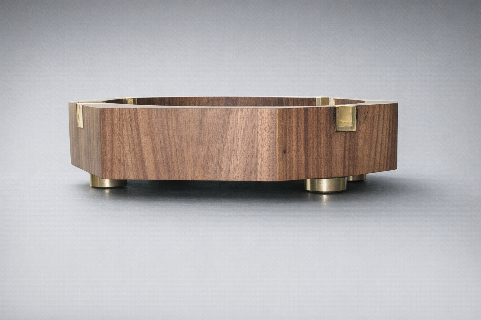 Polished walnut ashtray with brass accents.png