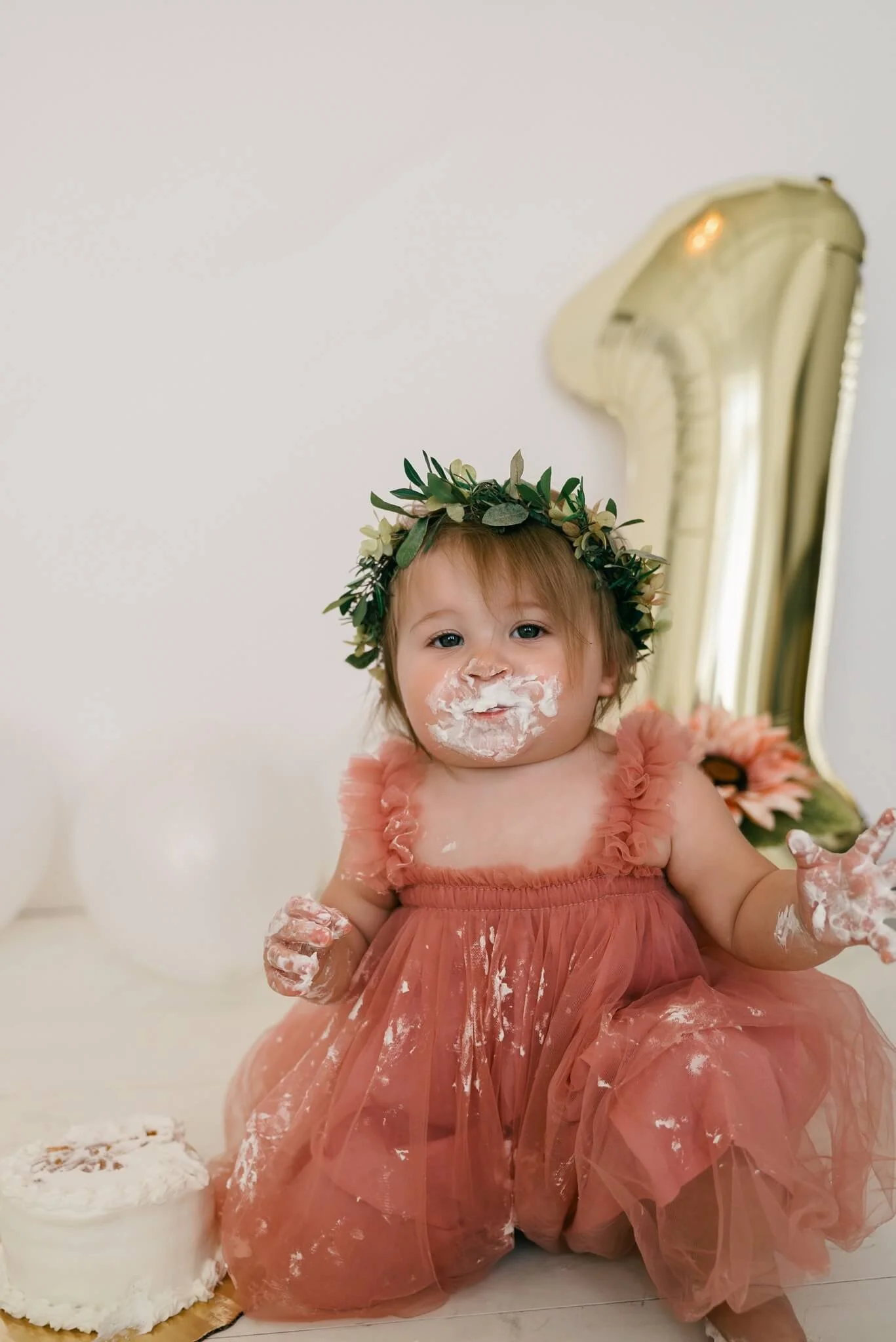 Baby in ruffle dress at 1 year old photo shoot