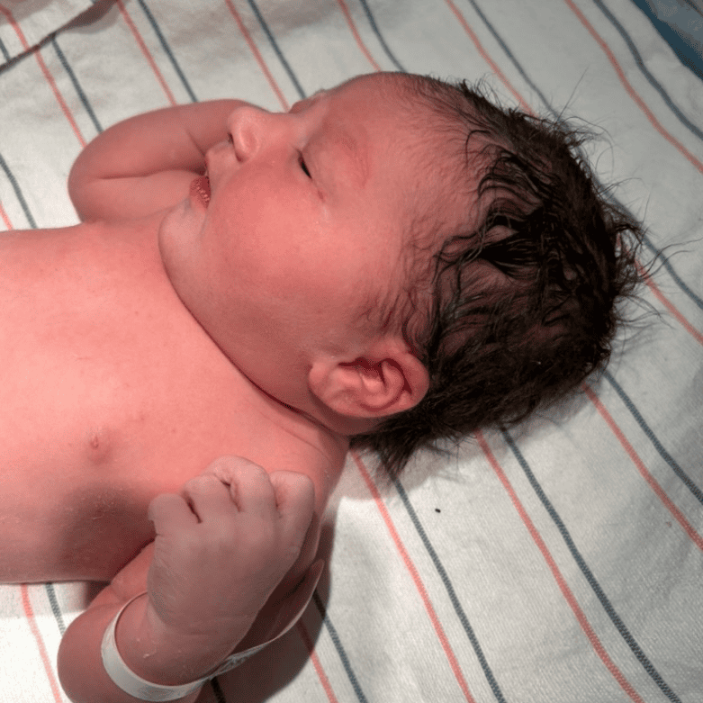 newborn baby moments after birth natural unmedicated hospital delivery Alpharetta GA