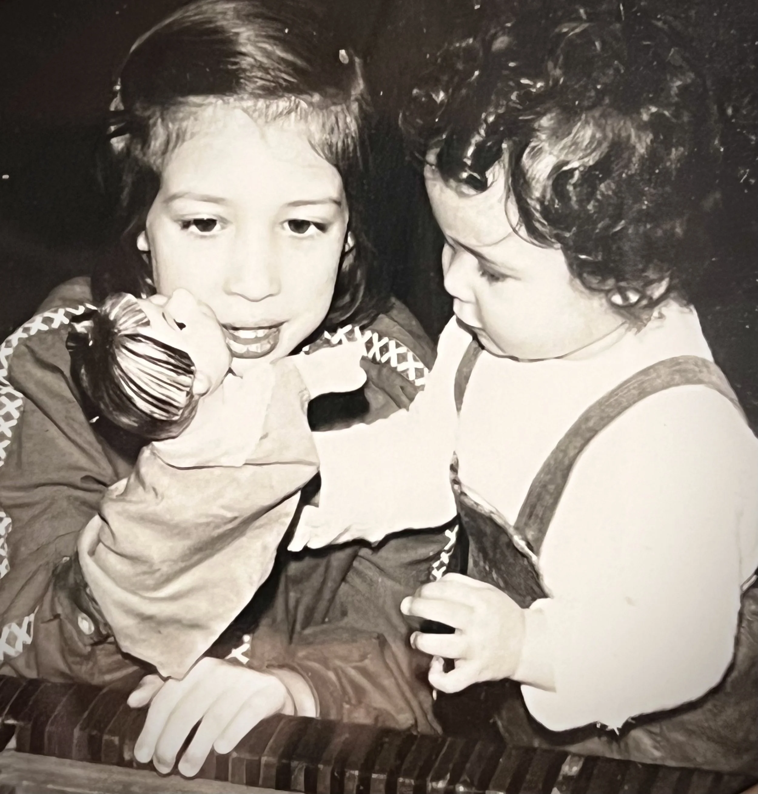 Six year old me, performing for my sister with a handpuppet