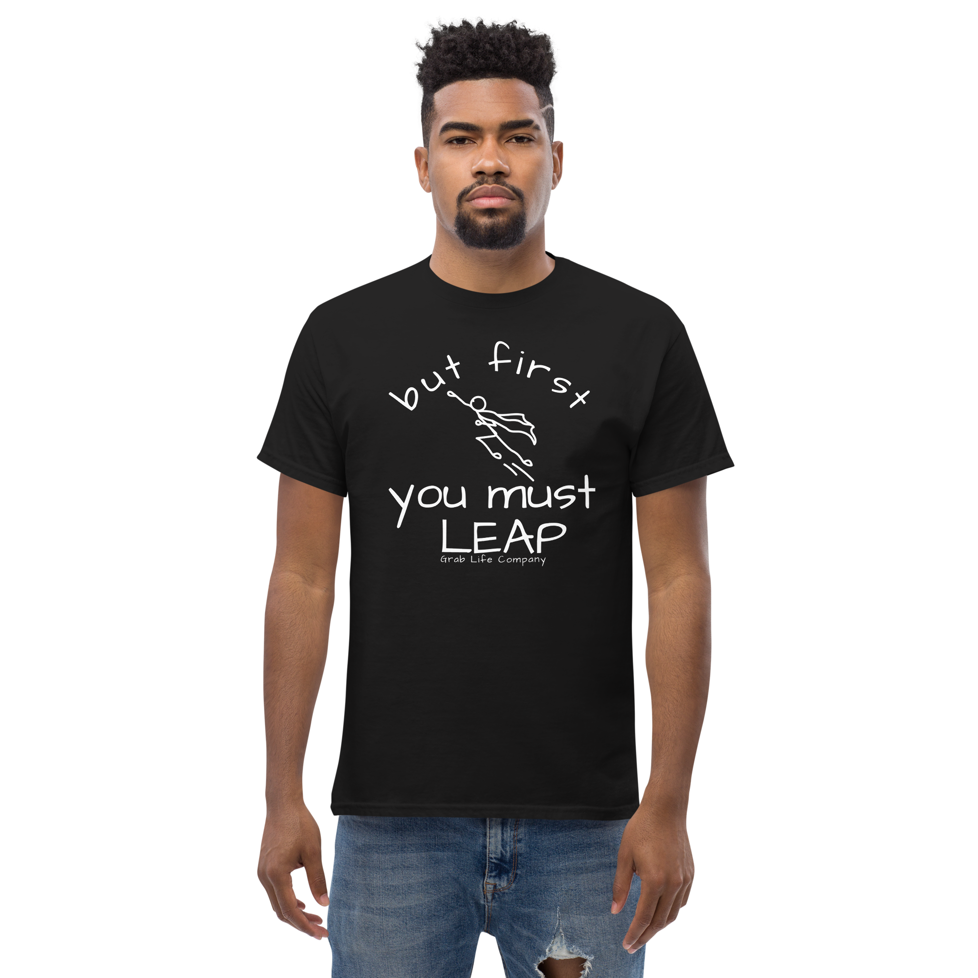 Grab Life Company t-shirt with But First You Must LEAP printed in white on front of black shirt. Image shows a man wearing the black shirt.