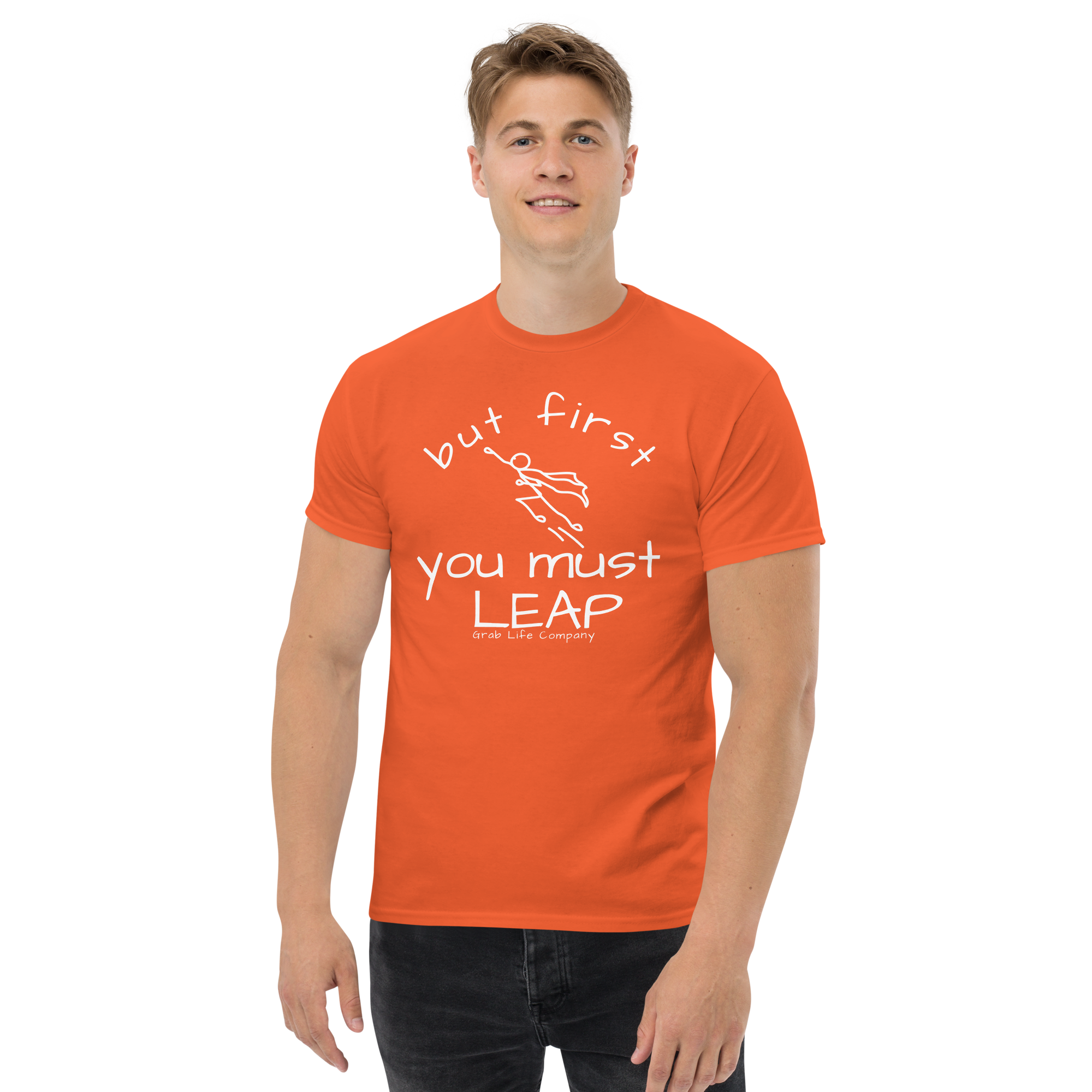 Grab Life Company t-shirt with But First You Must LEAP printed in white on front of orange shirt. Image shows a man wearing the orange shirt.