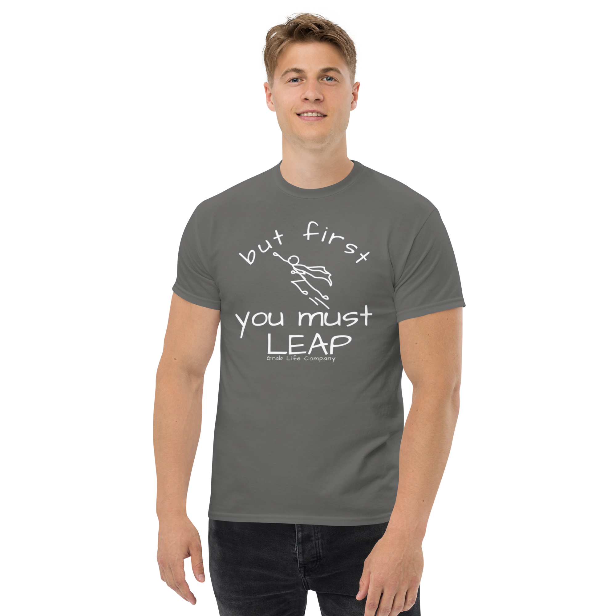 Grab Life Company t-shirt with But First You Must LEAP printed in white on front of charcoal grey shirt. Image shows a man wearing the charcoal grey shirt.