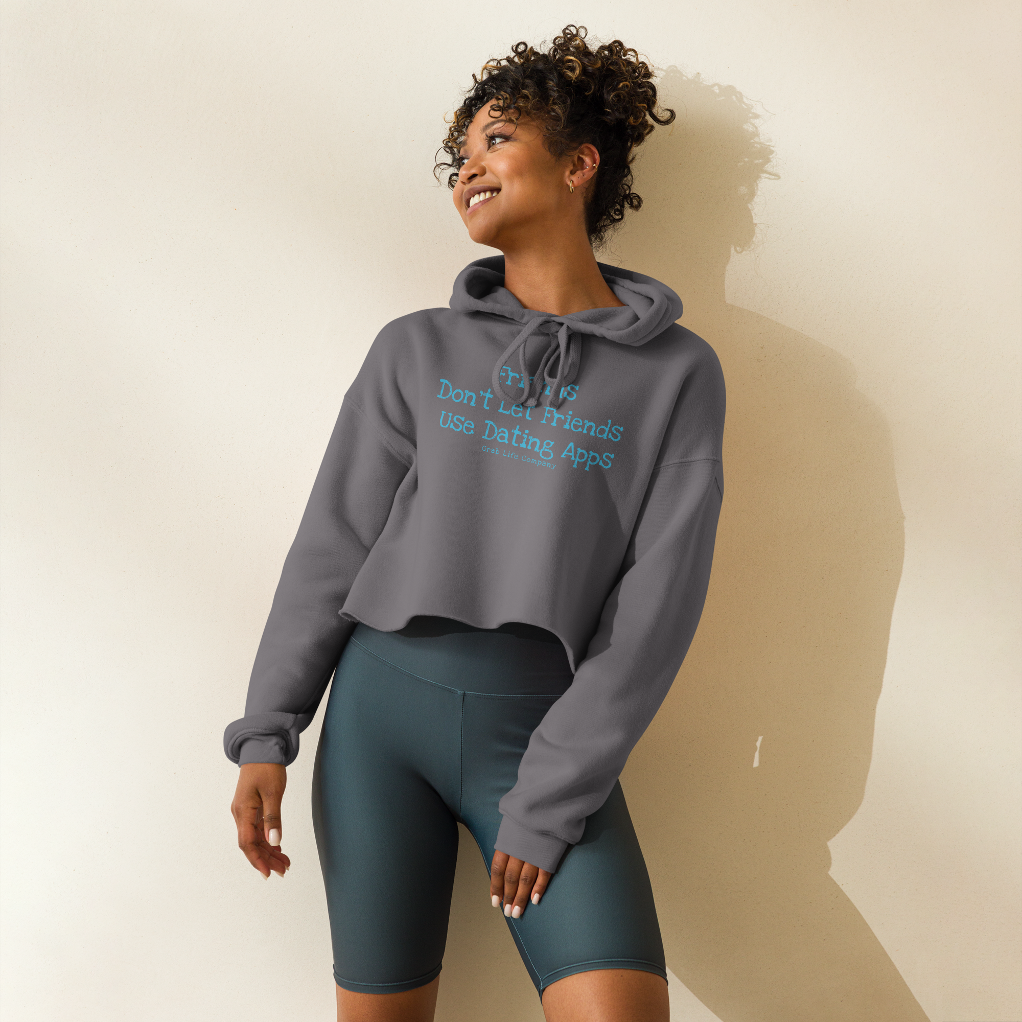 Grab Life Company cropped hoodie with Friends don't let Friends use Dating Apps printed on the front in blue on storm grey sweatshirt.