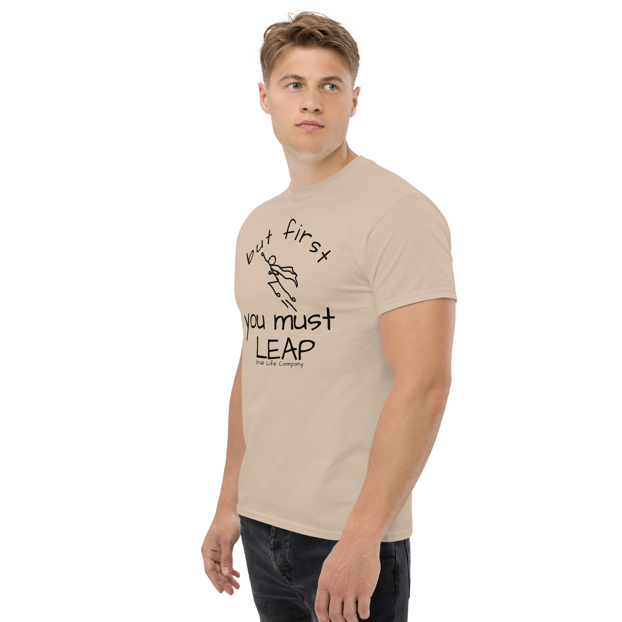 Grab Life Company t-shirt with But First You Must LEAP printed in black on front of sand shirt. Image shows a man wearing  shirt.