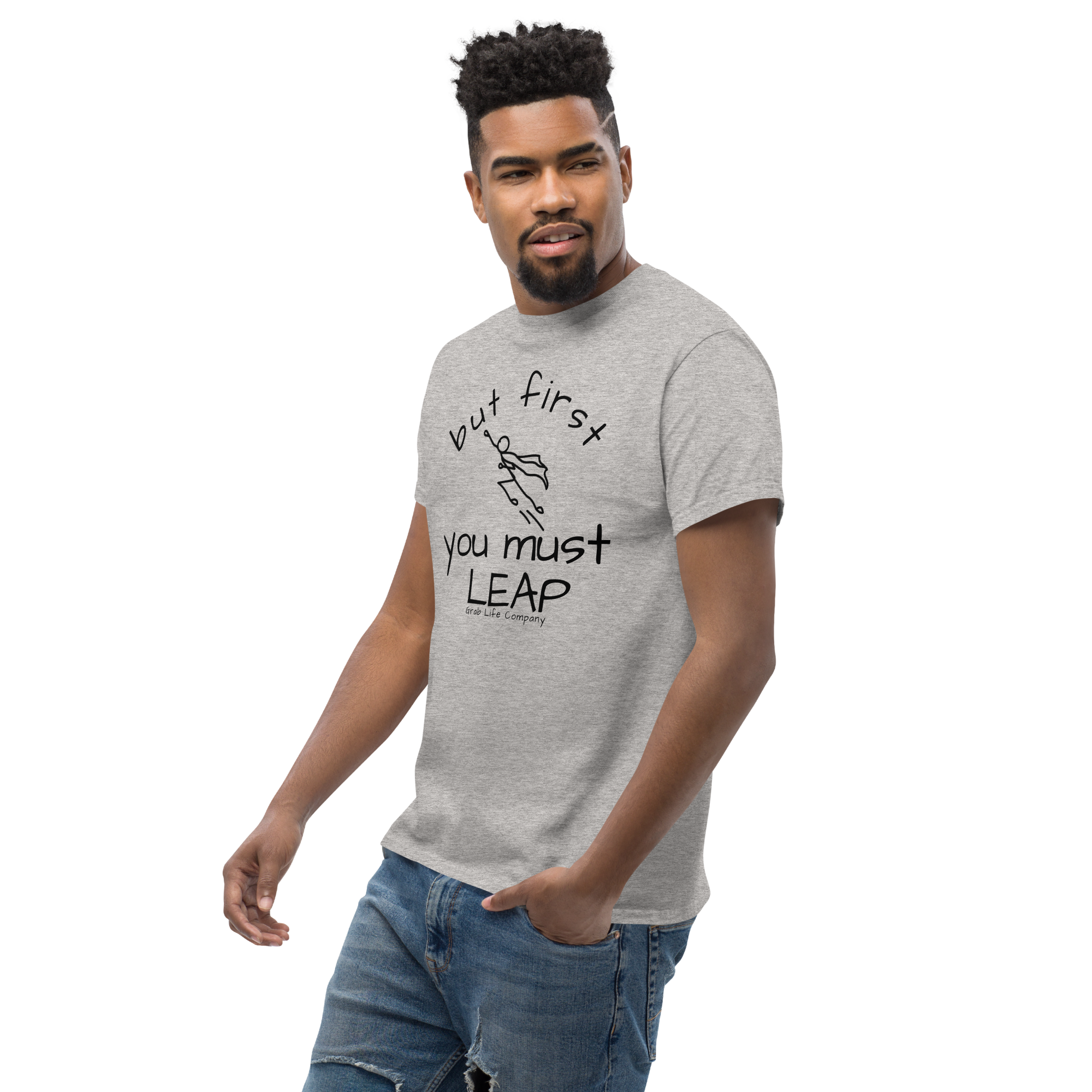Grab Life Company t-shirt with But First You Must LEAP printed in black on front of sport grey shirt. Image shows a man wearing shirt.