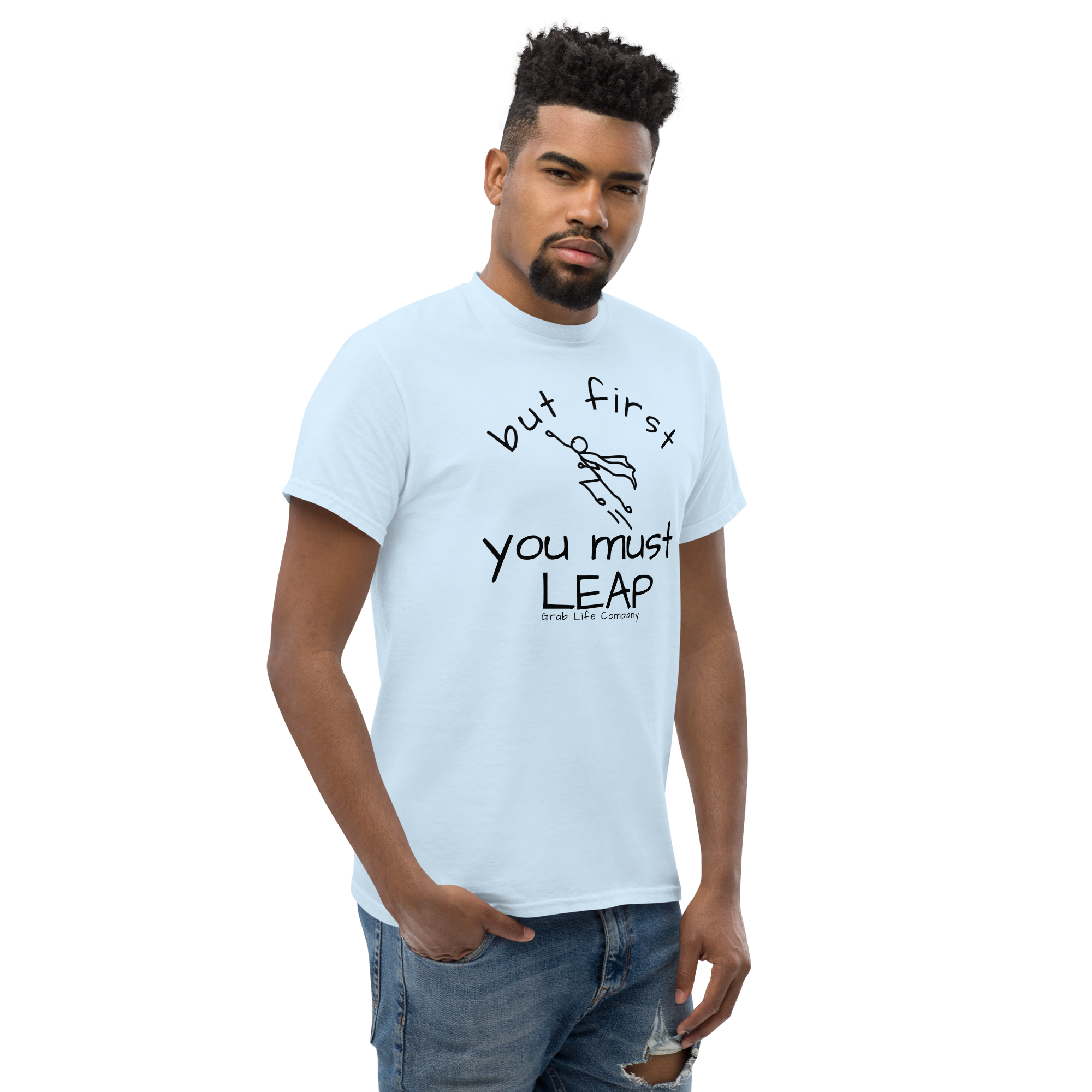 Grab Life Company t-shirt with But First You Must LEAP printed in black on front of a light blue shirt. Image shows a man wearing the shirt.