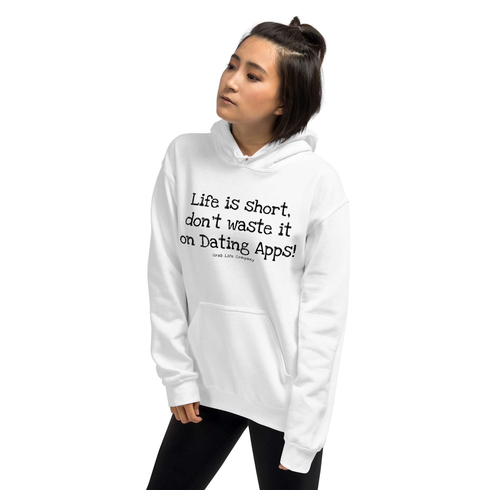 Grab Life Company unisex sweatshirt with Life is Short Don't Waste it on Dating Apps printed in black on white hoodie. Image shows woman wearing the sweatshirt.
