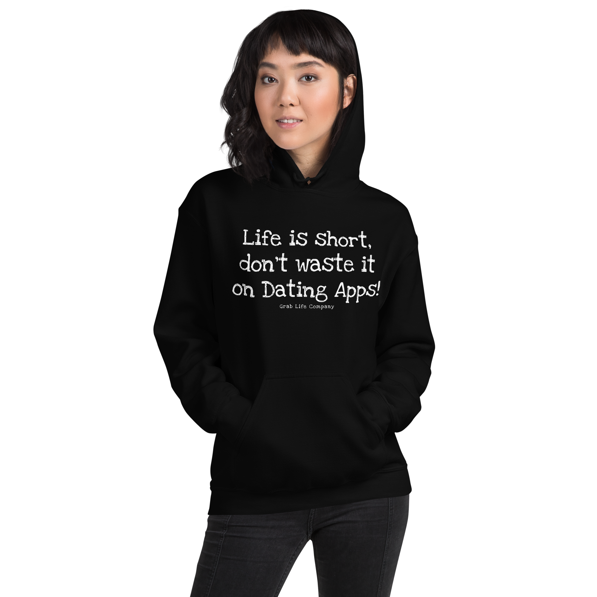 Grab Life Company unisex sweatshirt with Life is Short Don't Waste it on Dating Apps printed in white on black hoodie. Image shows woman wearing the sweatshirt.